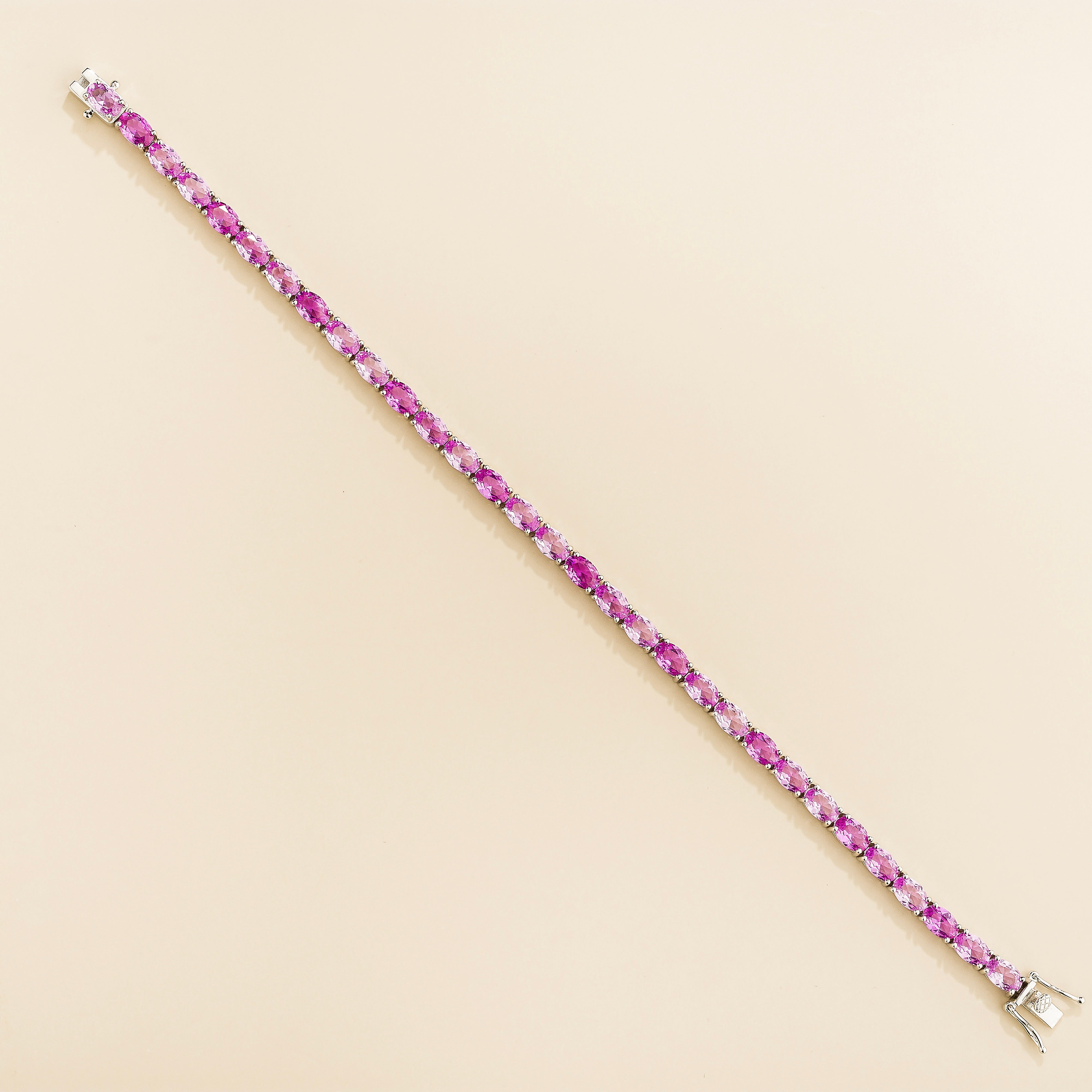 Salto Pastel Pink Sapphire Oval Tennis Bracelet in White Gold