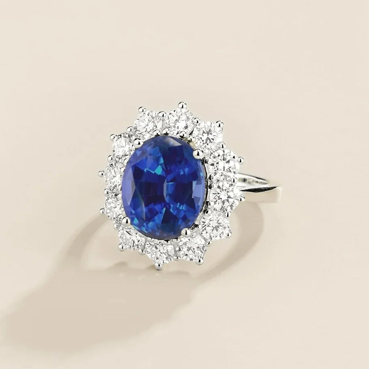 Oda Blue Sapphire Oval & Diamond Halo Ring – angle view