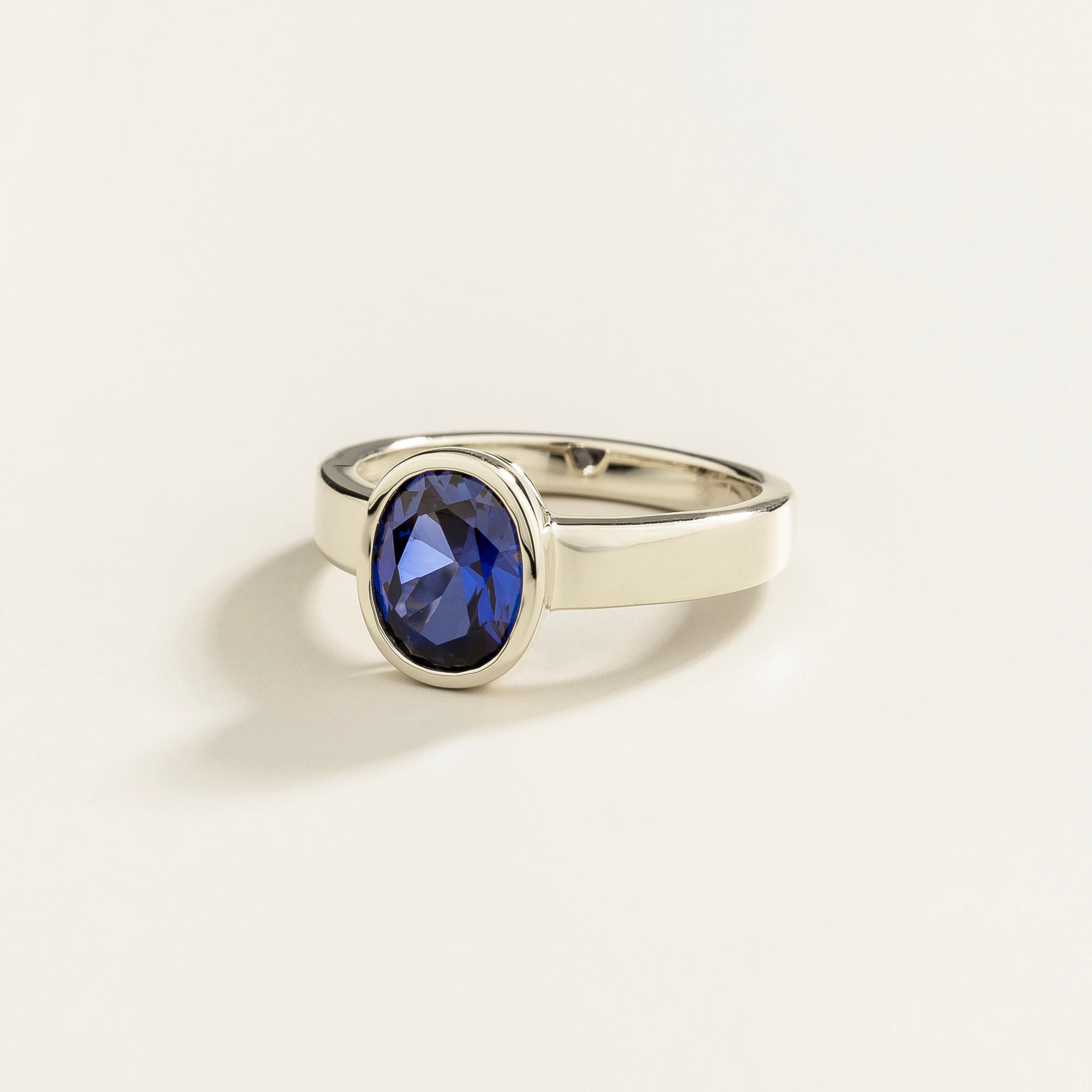 Fuerte Oval Blue Sapphire Bezel-Set Ring in White Gold