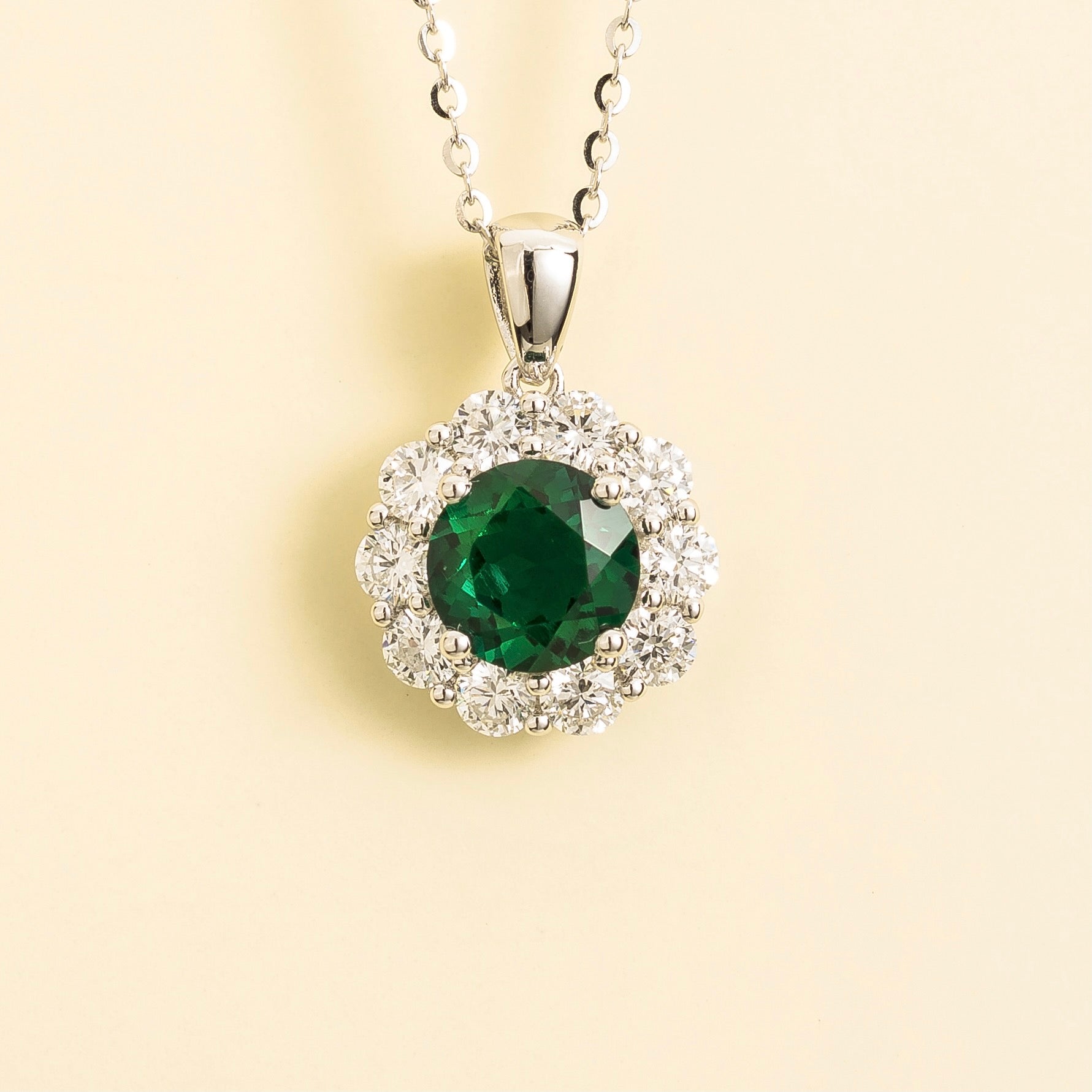 Floret Emerald Round & Diamond Halo Pendant Necklace in White Gold