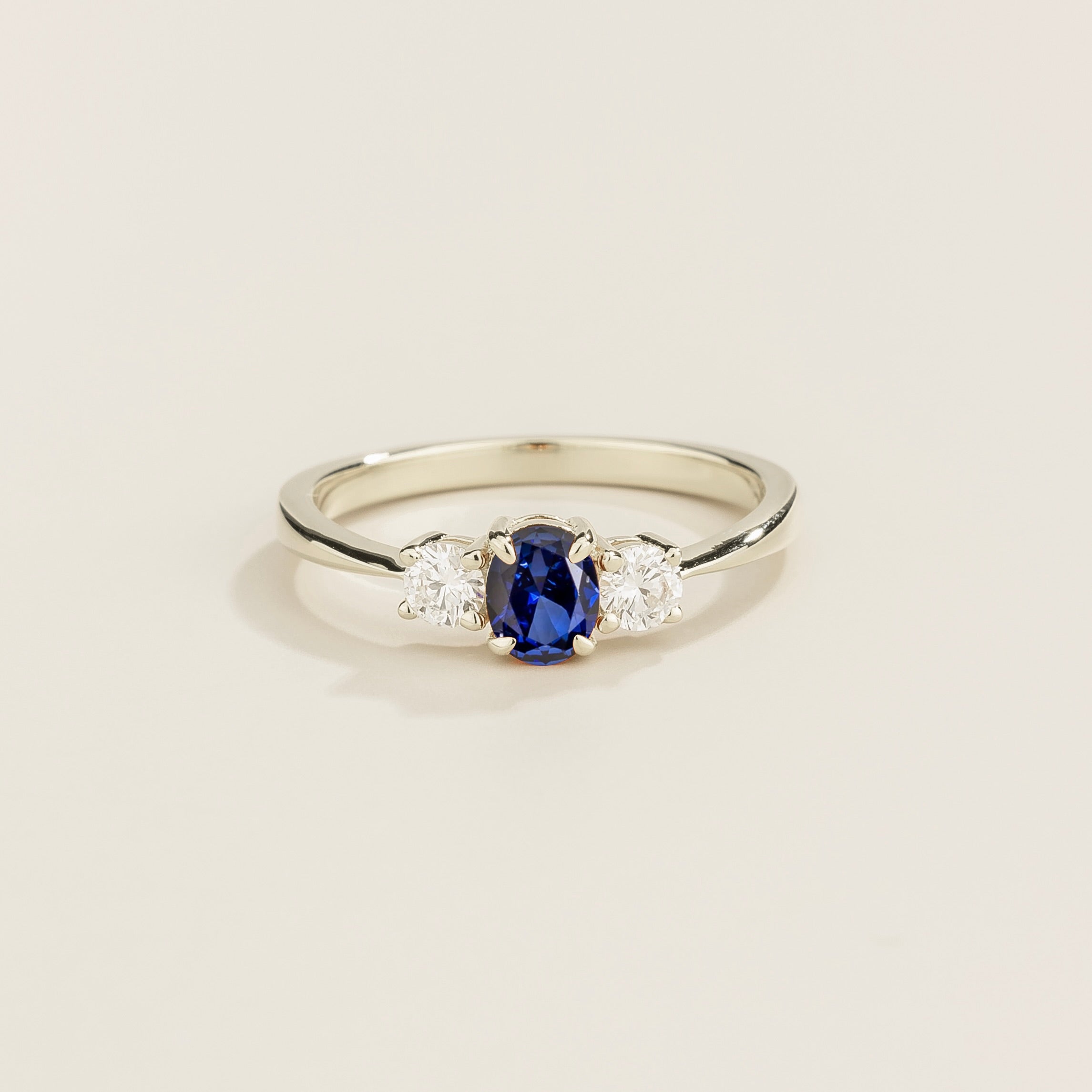 Oval lab-grown blue sapphire and diamond three-stone Boble ring in white gold | Juvetti London