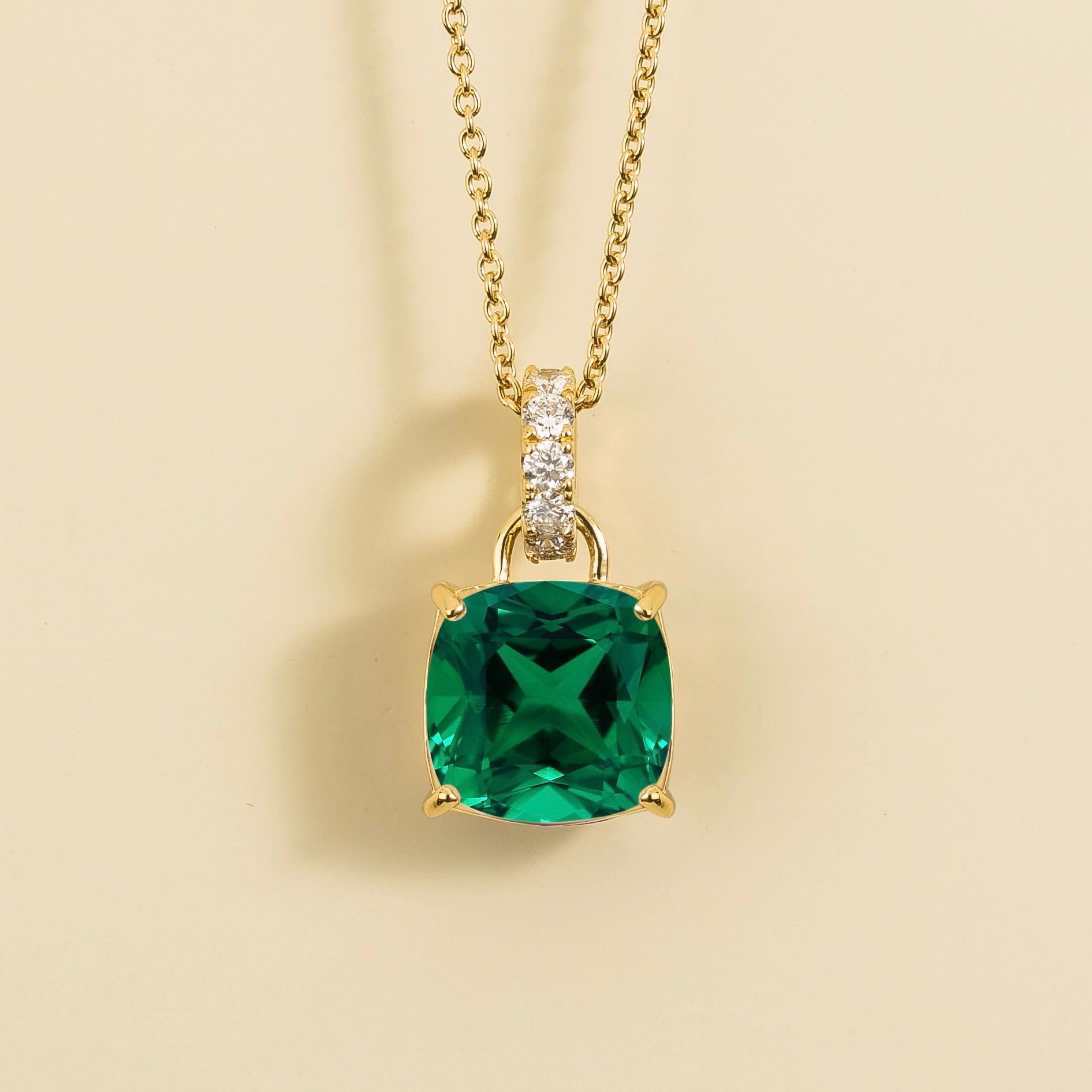 Cushion-cut lab-grown emerald and diamond hoop pendant necklace, Roue design in gold | Juvetti London