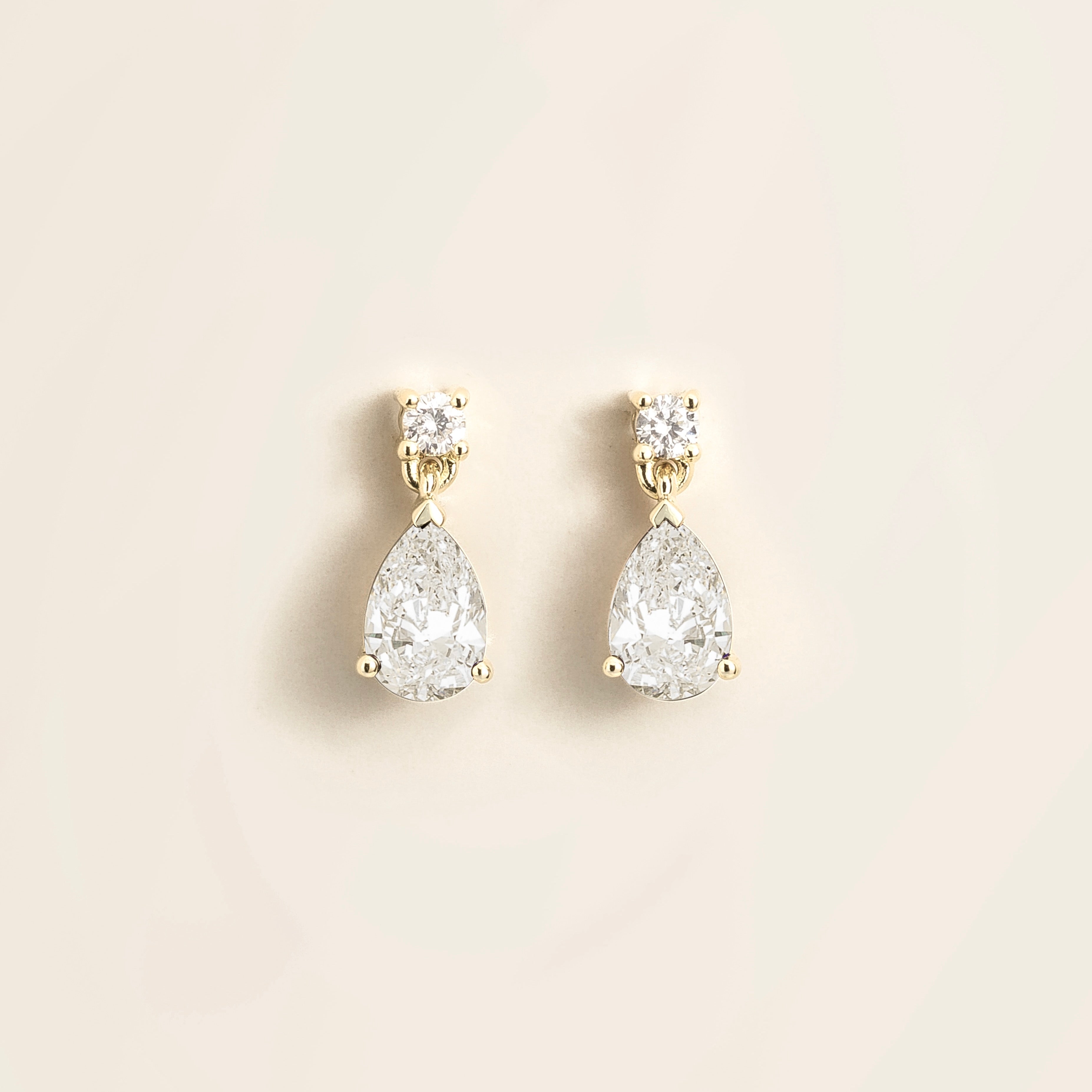 Pisa Diamond Pear Drop Earrings in White Gold