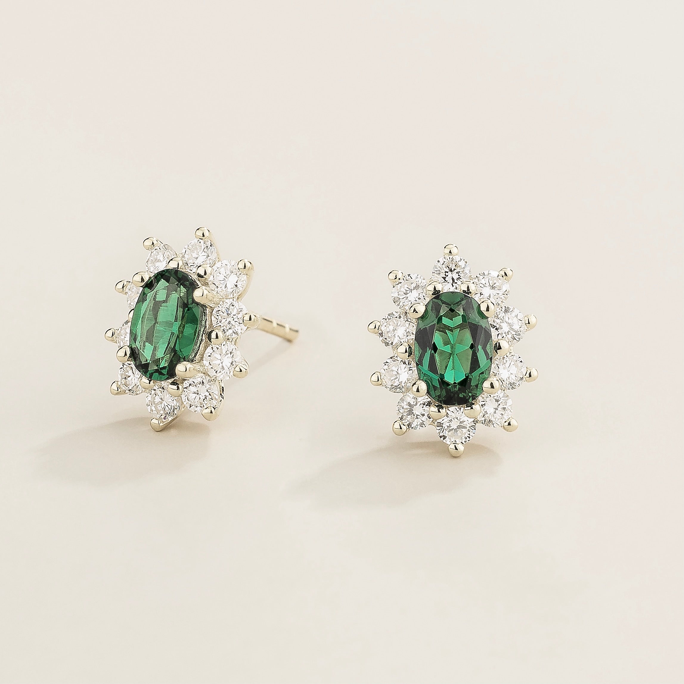 Oda Emerald Oval & Diamond Halo Earrings In White Gold