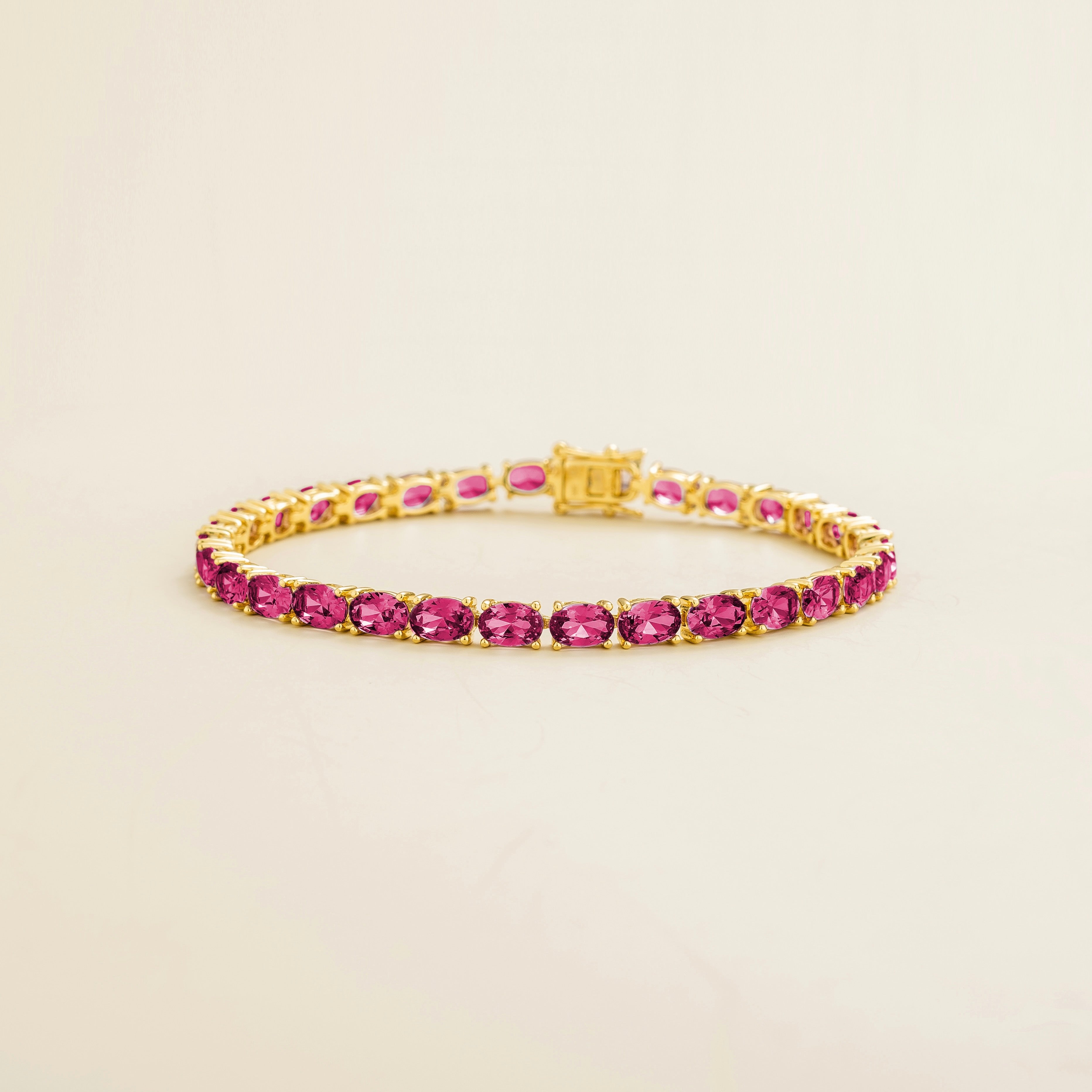 Salto Vivid Pink Sapphire Oval Tennis Bracelet in Gold