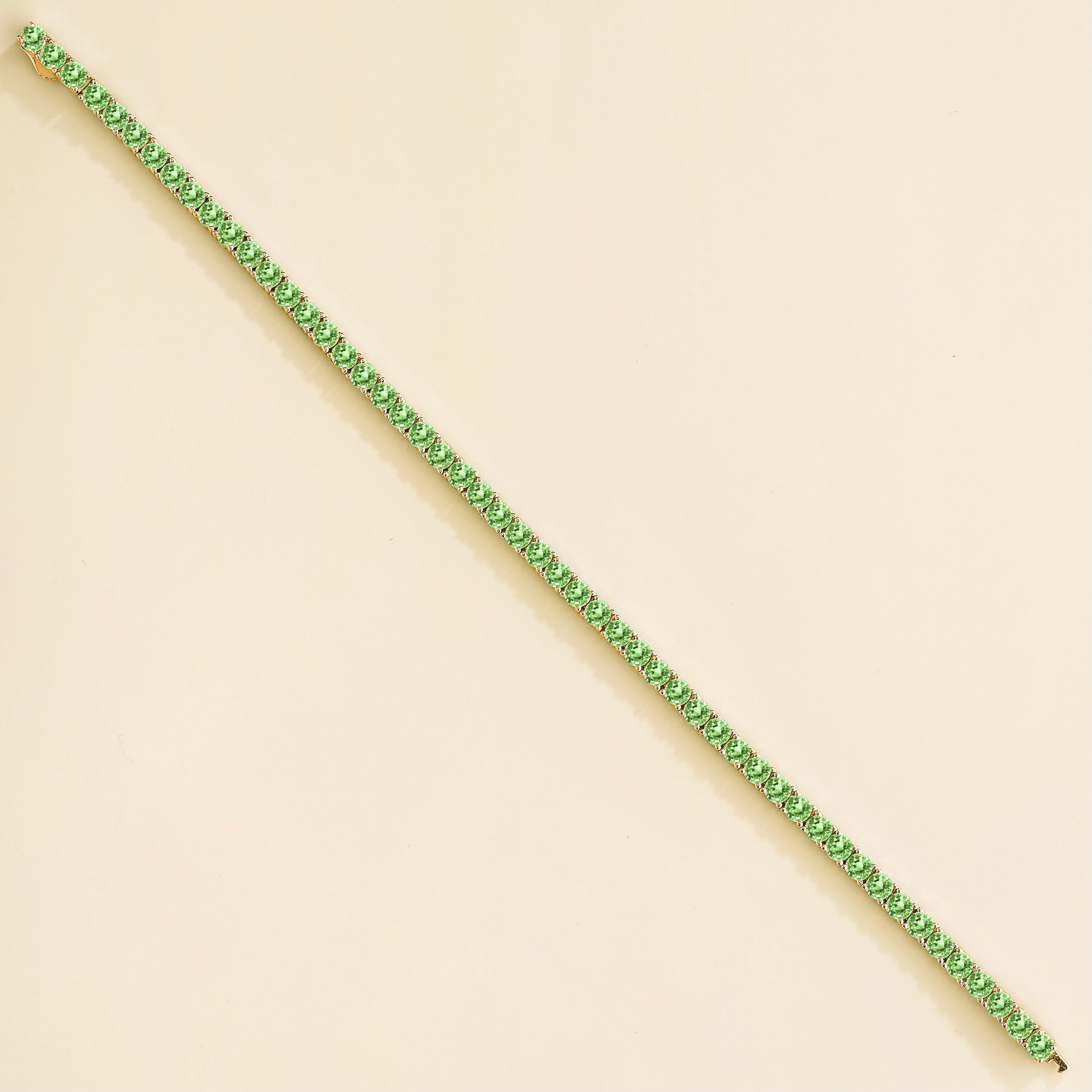 Ciclo Green Sapphire Round Tennis Bracelet in Gold