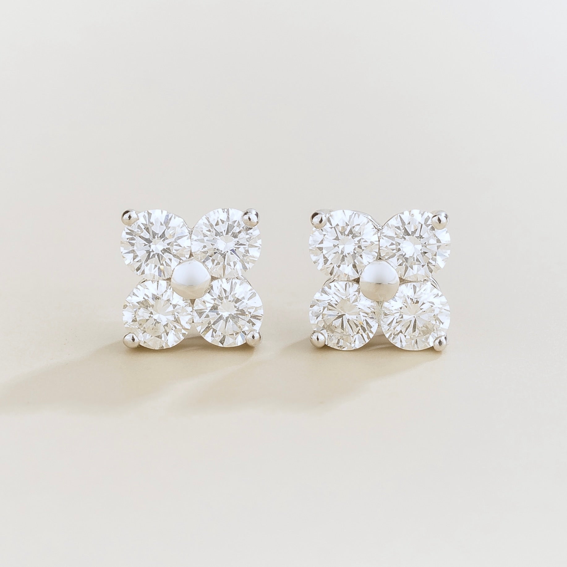 Juvetti white gold clover stud earrings with round lab-grown diamonds.