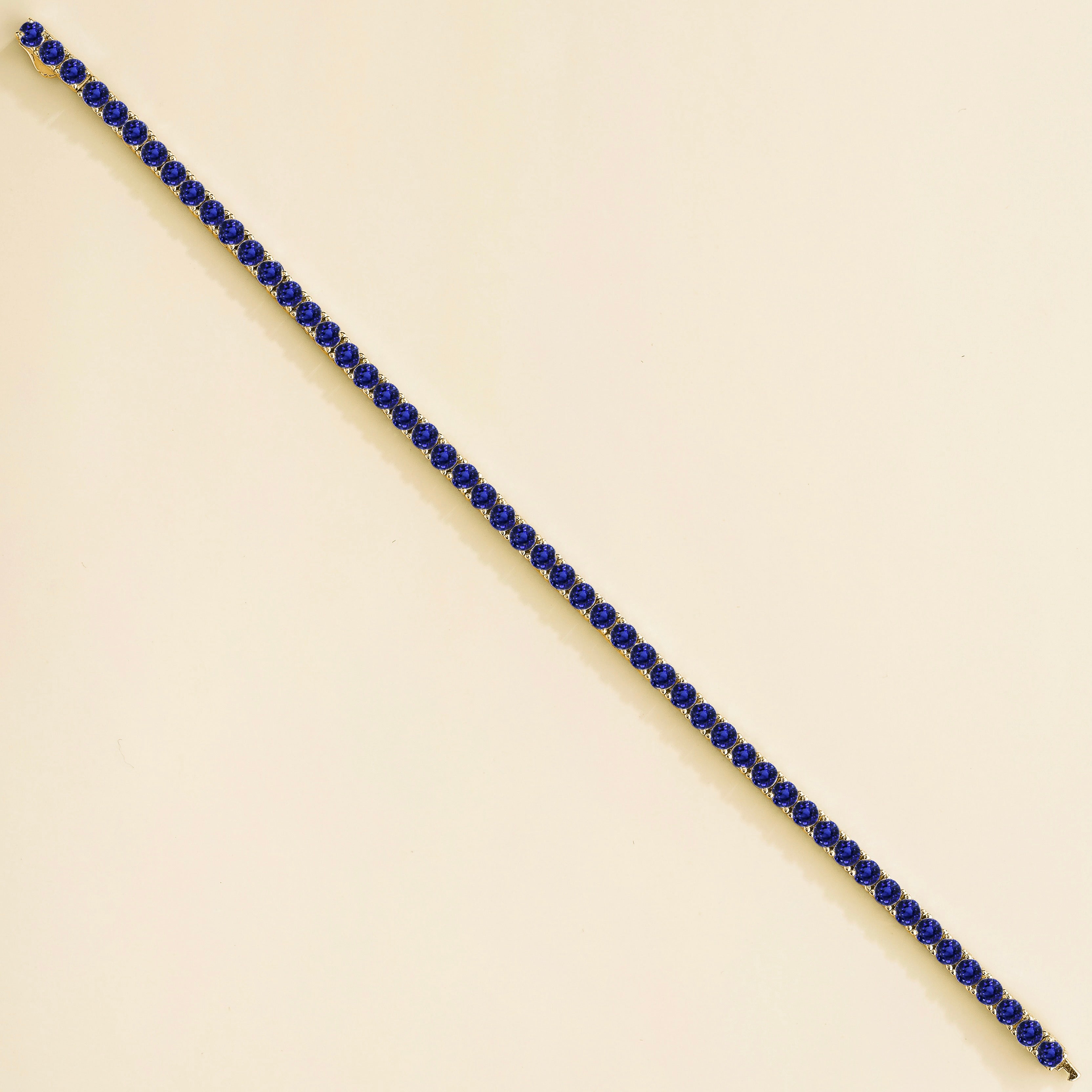 Ciclo Blue Sapphire Round Tennis Bracelet in White Gold