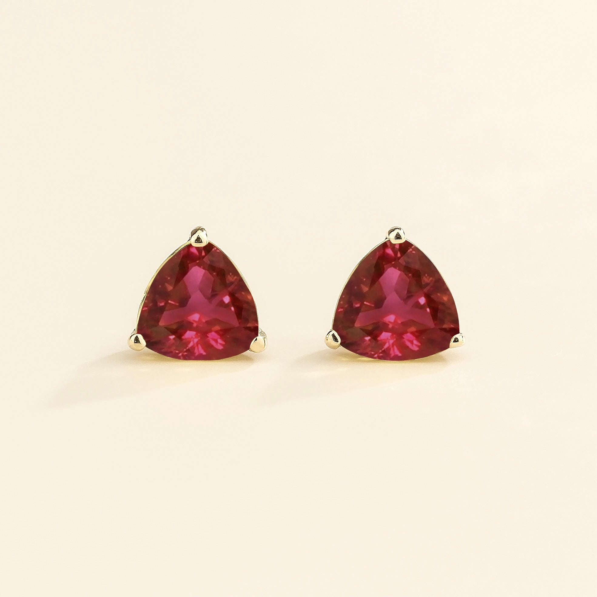 Trillion Ruby Stud Earrings in White Gold