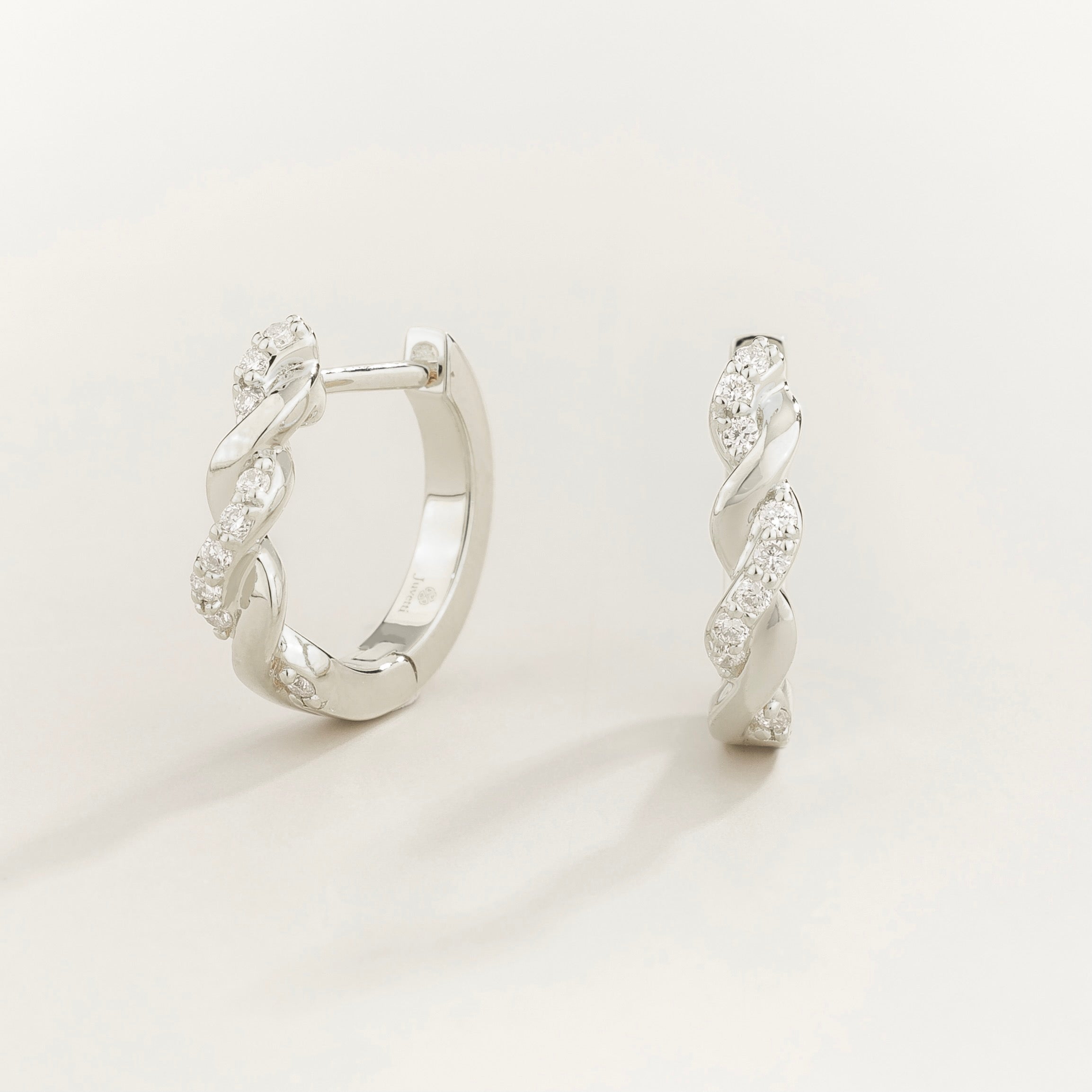Twist diamond hoop huggie earrings in white gold
