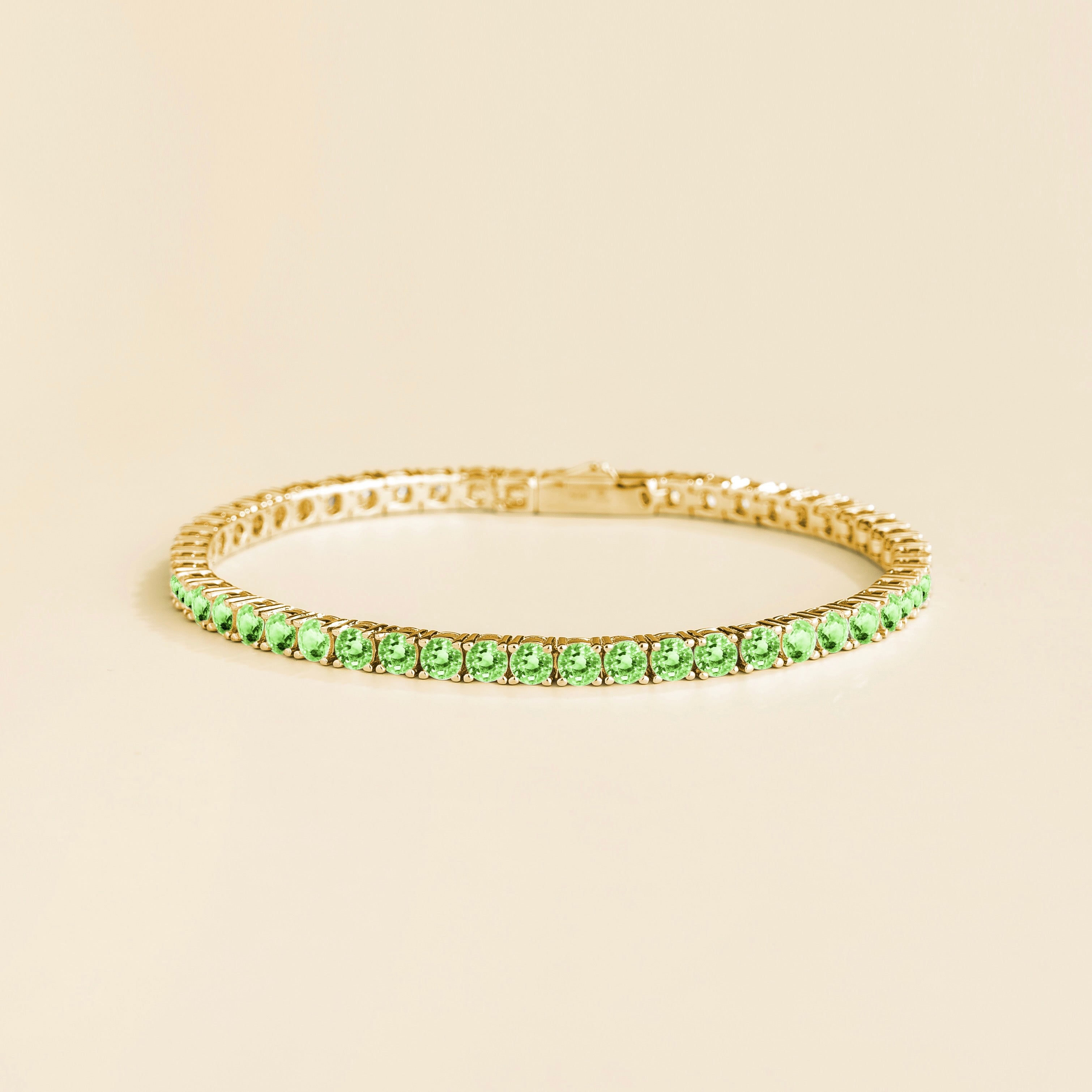 Ciclo Green Sapphire Round Tennis Bracelet in Gold