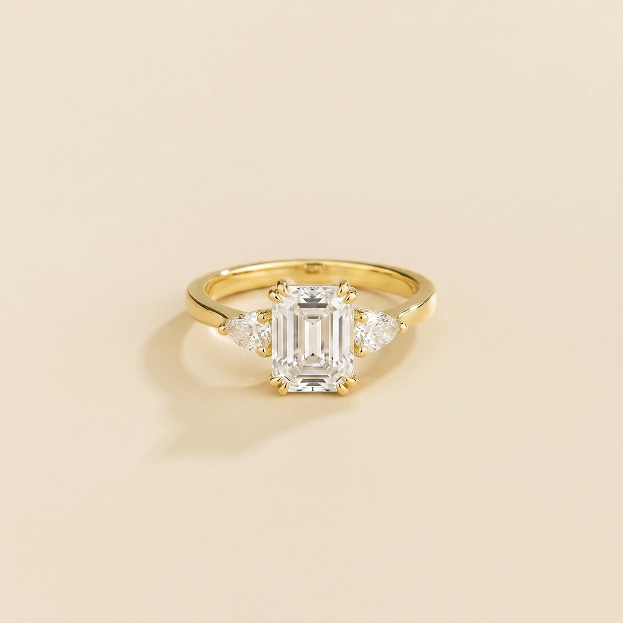 Emerald-cut lab-grown diamond ring with pear-cut diamond sides, Ailes design in gold | Juvetti London