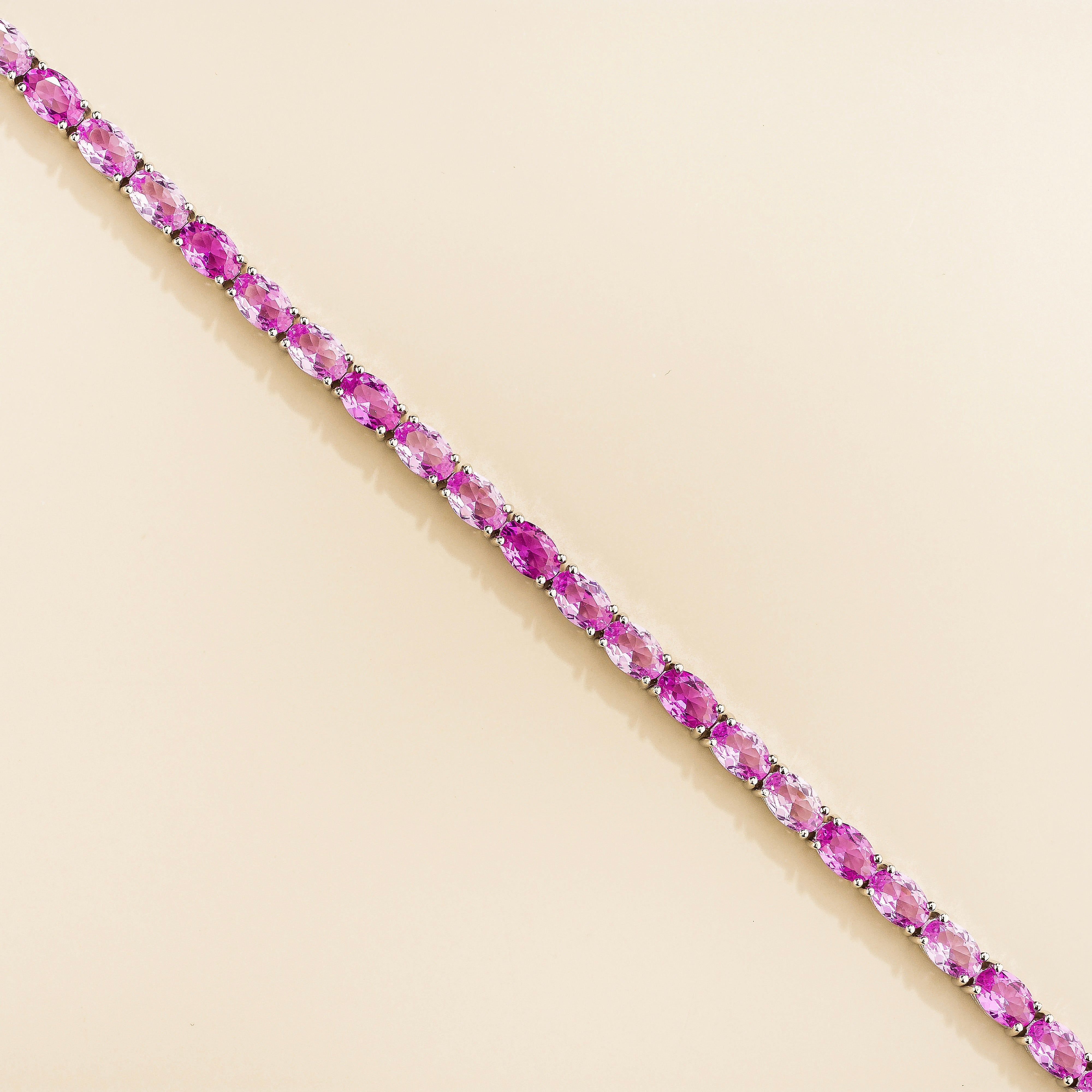 Salto Pastel Pink Sapphire Oval Tennis Bracelet in White Gold