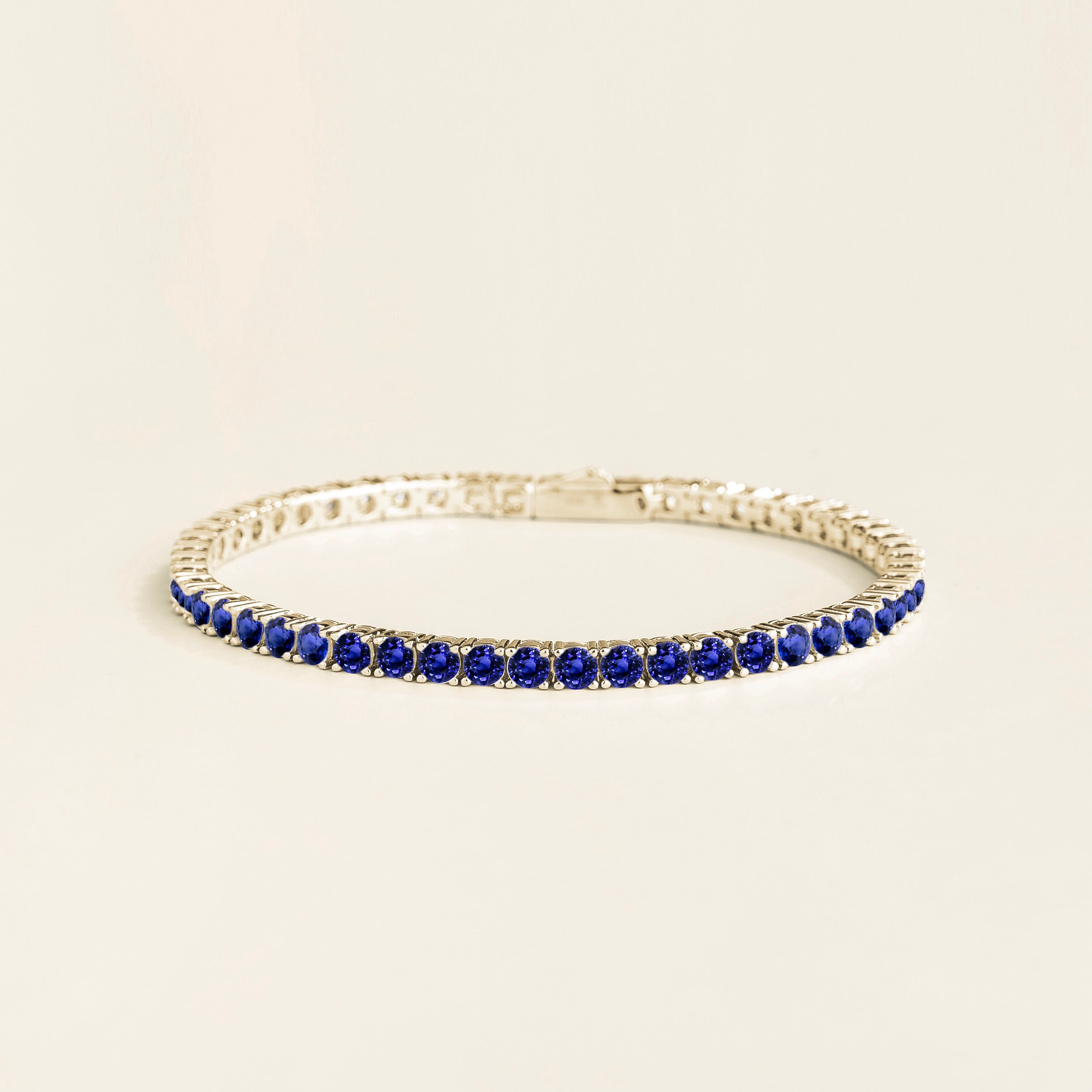 Ciclo Blue Sapphire Round Tennis Bracelet in White Gold