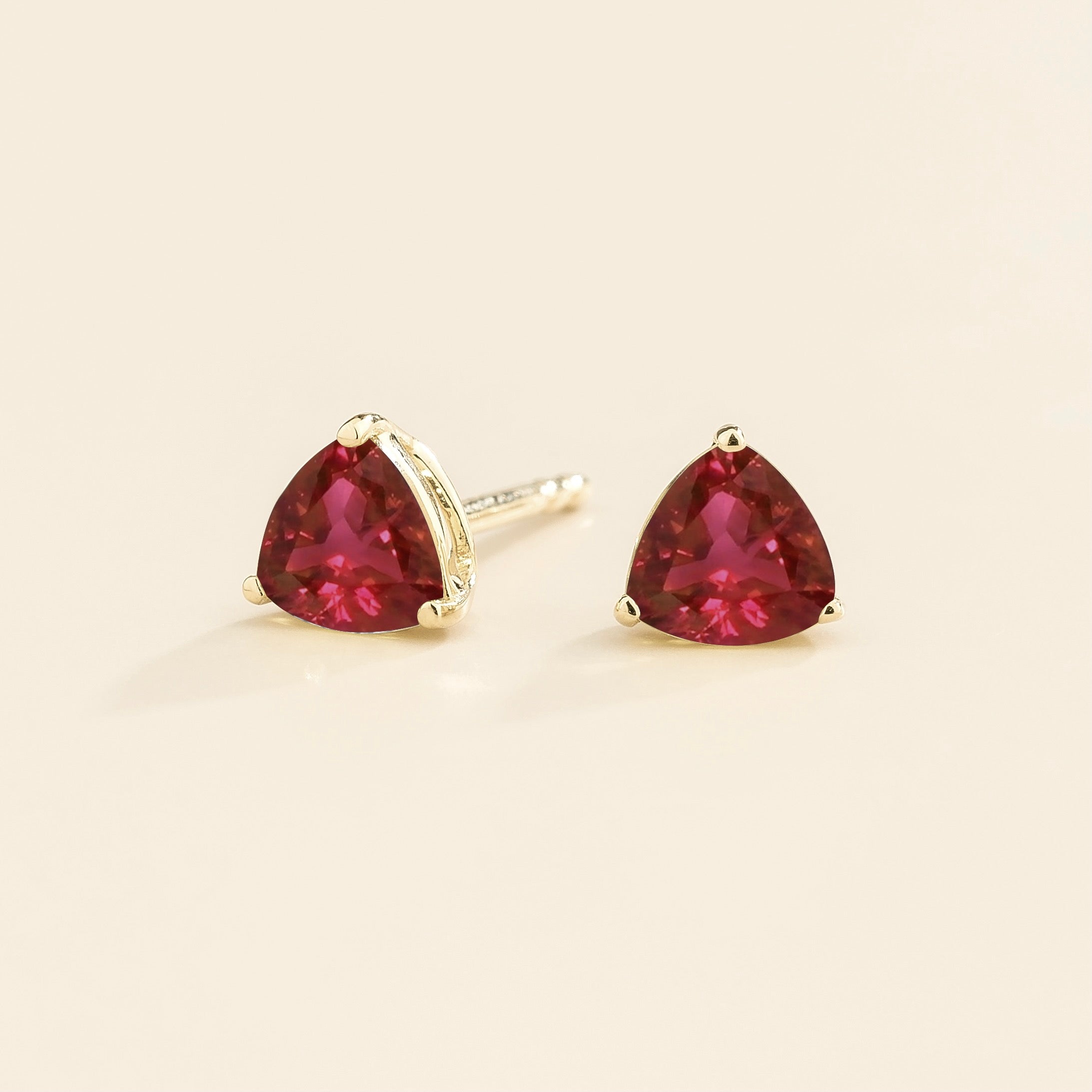 Trillion Ruby Stud Earrings in White Gold