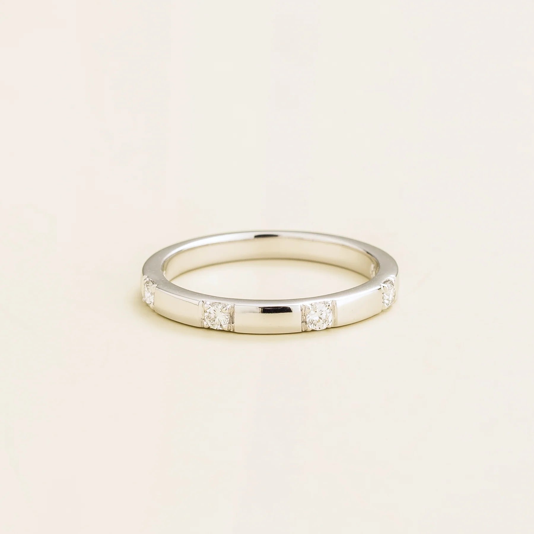 Juvetti white gold band set with round lab-grown diamonds in a sleek modern design.