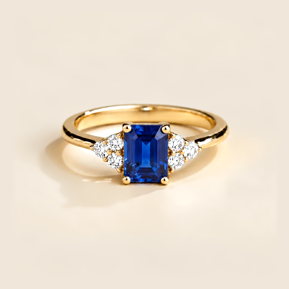 Emerald-cut lab-grown blue sapphire and diamond Chateau ring in gold | Juvetti London