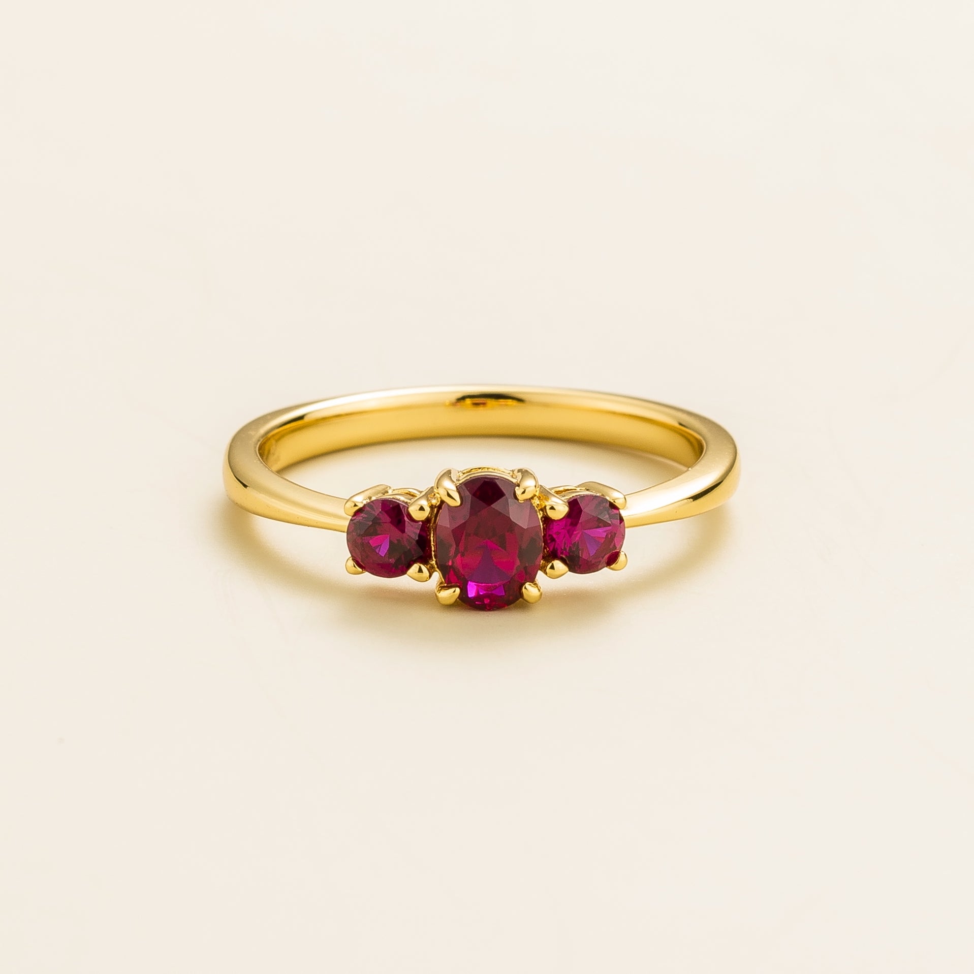 3 gemstones gold ring with three ruby gemstones prominently displayed in a crown setting – Juvetti London