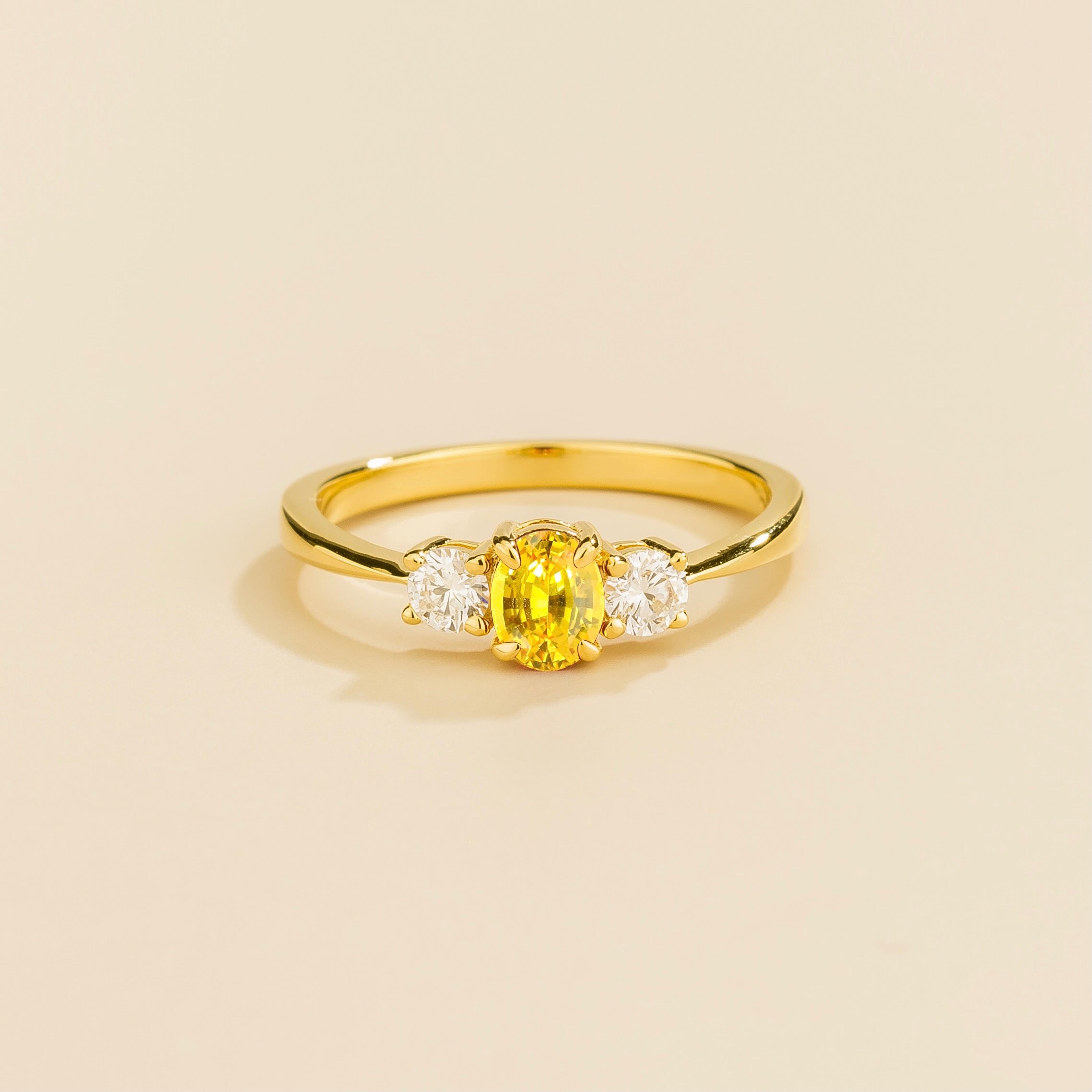 3 gemstone yellow gold ring featuring a central yellow sapphire with two smaller diamonds on each side – Juvetti London