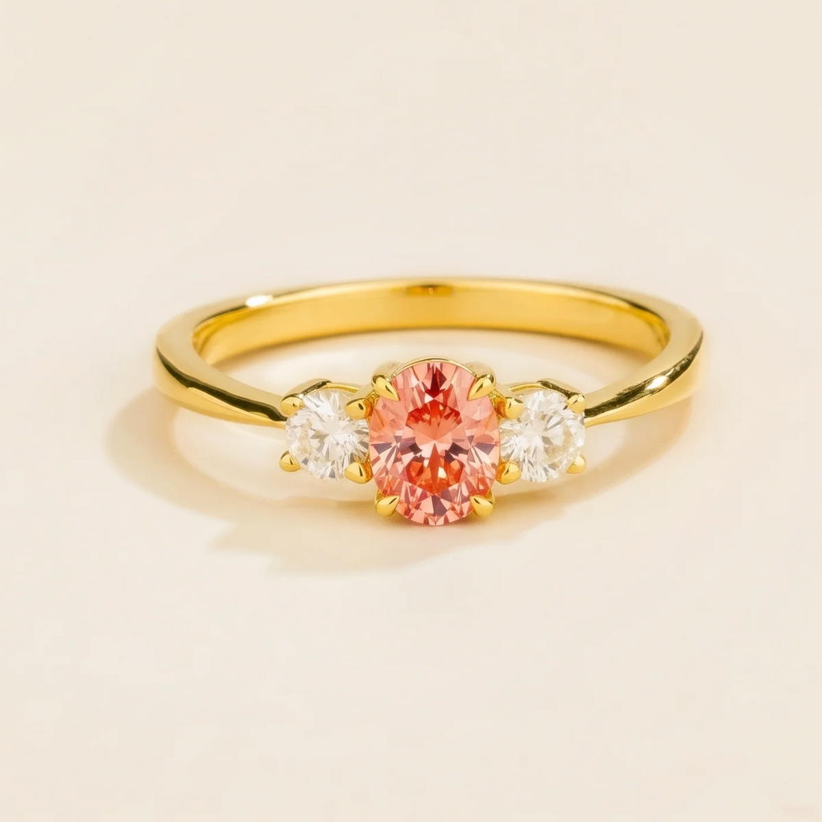 Oval lab-grown padparadscha sapphire and diamond three-stone Boble ring in gold | Juvetti London