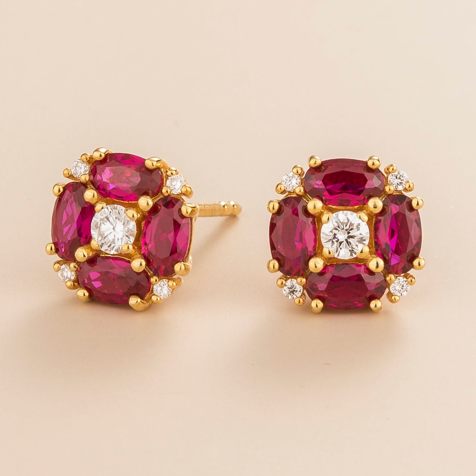 Pristi earrings in 18K gold vermeil set with lab grown Diamond and oval Ruby gem stones.