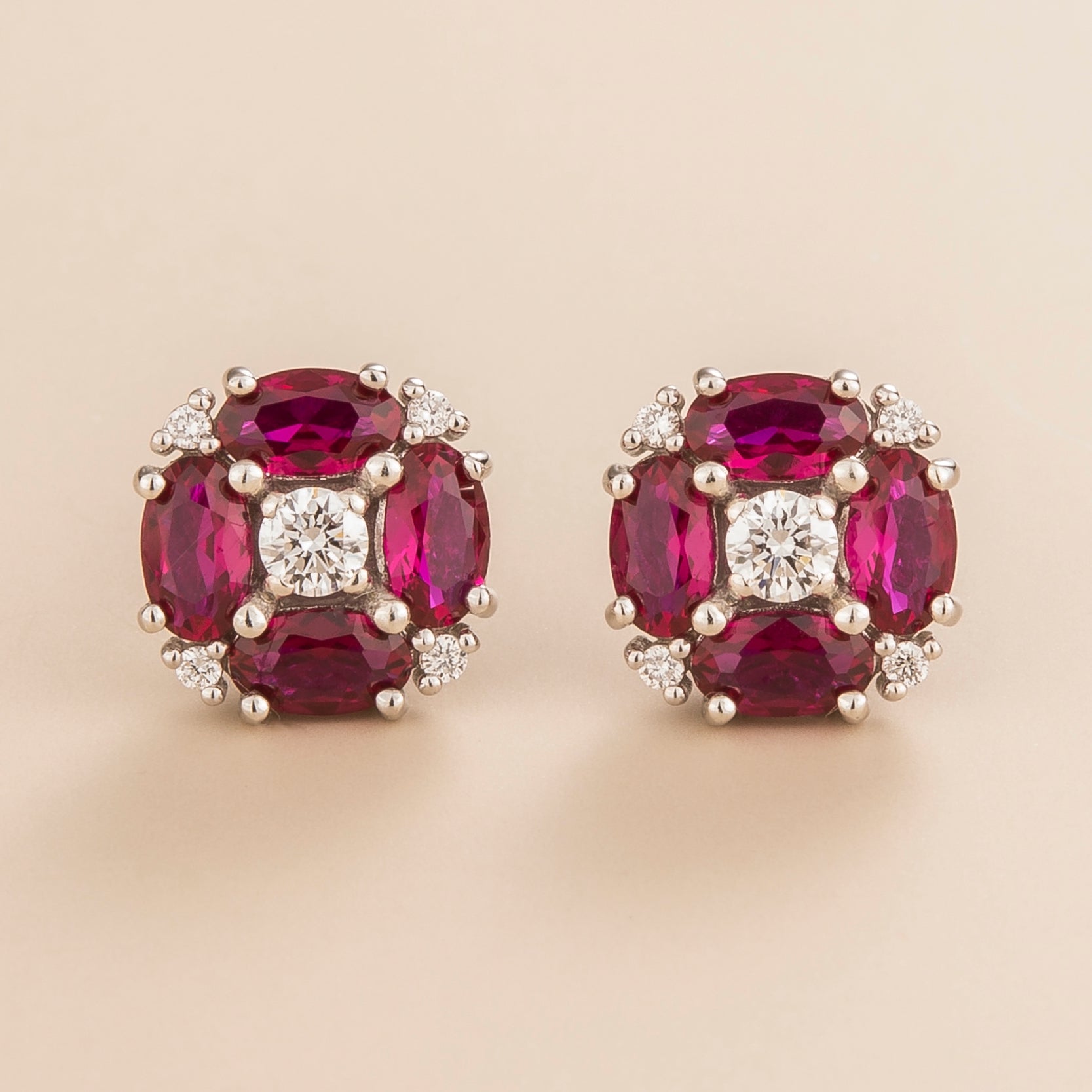 Pristi earrings in 18K white gold vermeil set with round lab grown Diamonds and oval Ruby gem stones.