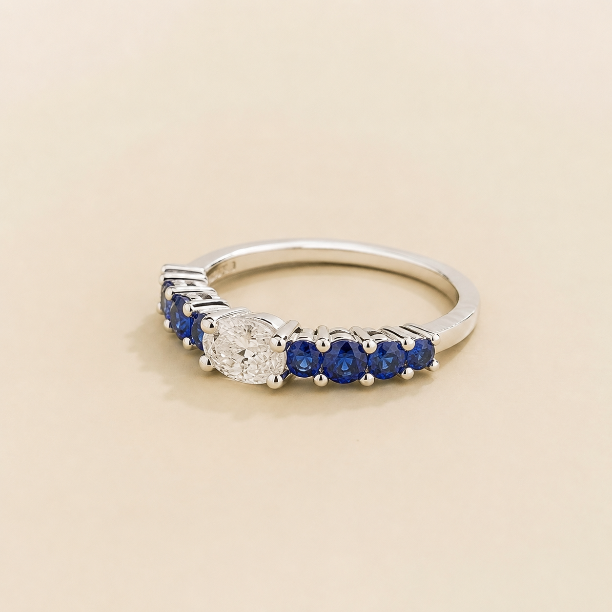 Petra Oval Diamond and Blue Sapphire Half Eternity Ring in White Gold Angle view