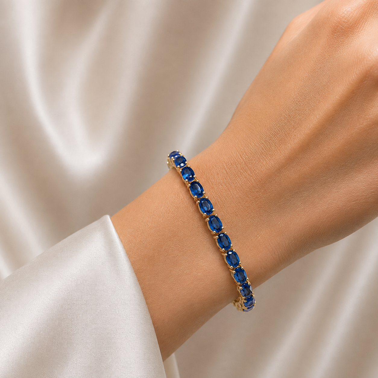Salto Blue Sapphire Oval Tennis Bracelet in Gold