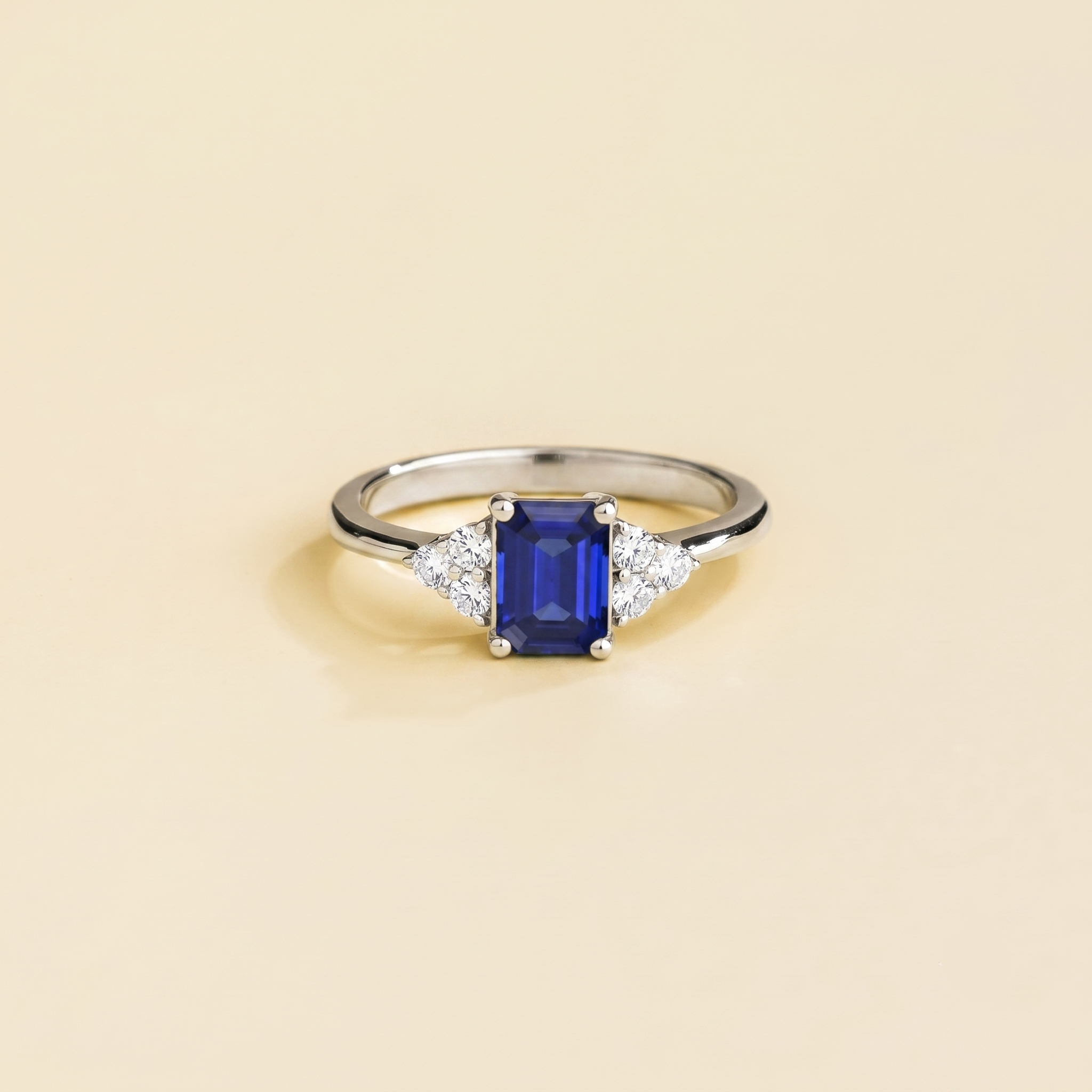 Emerald-cut lab-grown blue sapphire and diamond Chateau ring in white gold | Juvetti London