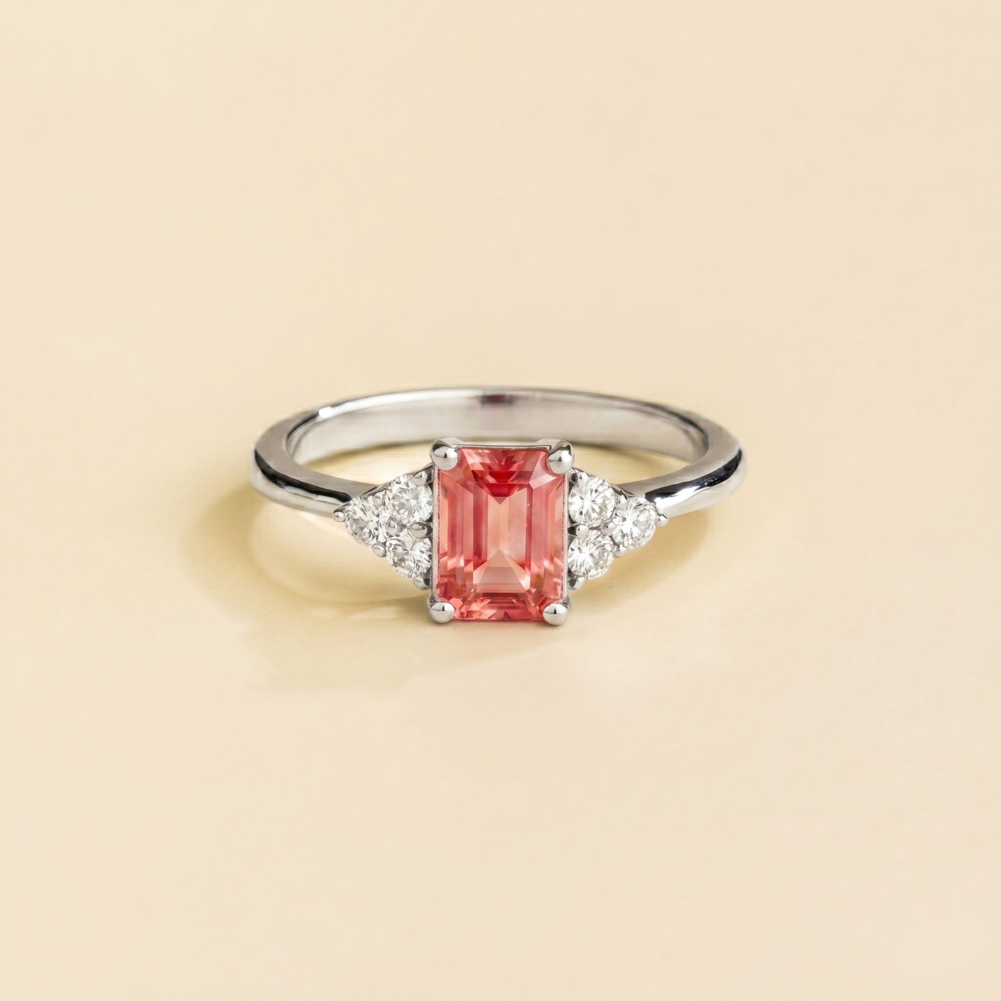 Emerald-cut lab-grown padparadscha sapphire and diamond Chateau ring in white gold | Juvetti London