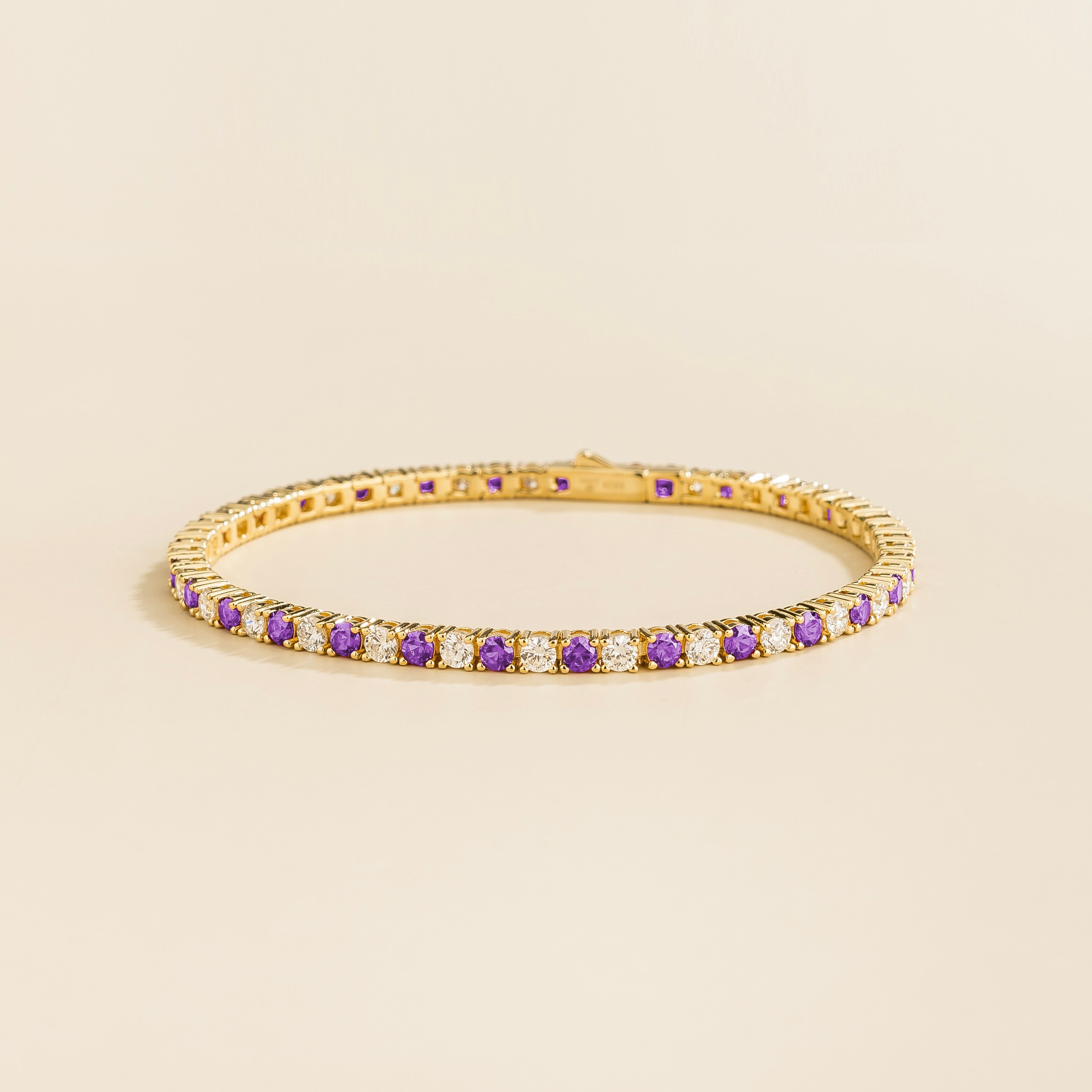 ciclo gold tennis bracelet with round purple sapphire and lab grown diamonds