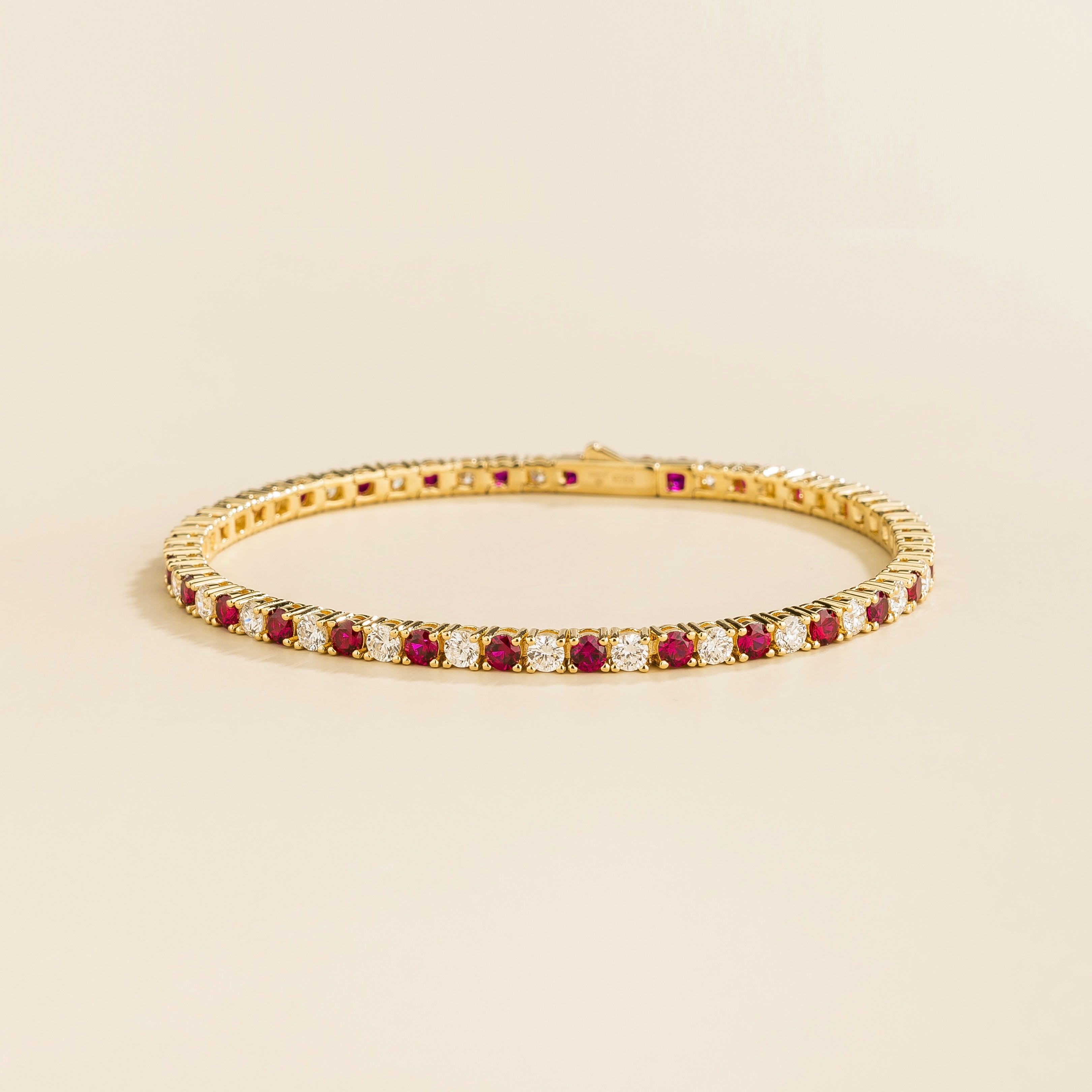 ciclo gold tennis bracelet with round ruby and lab grown diamonds