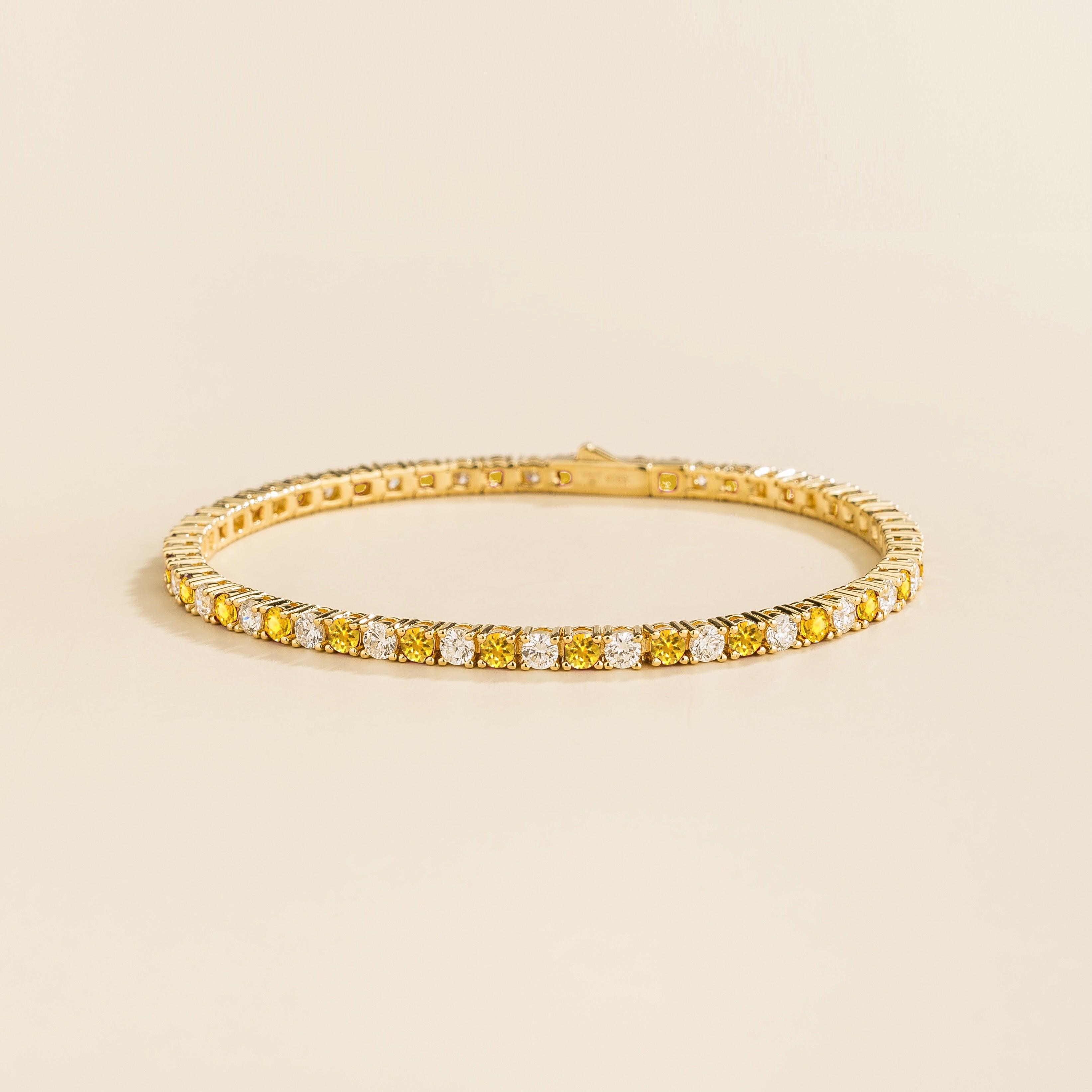 Ciclo Gold Tennis Bracelet with round Lab-Grown Yellow Sapphire & DEF VS Diamond ā Juvetti London