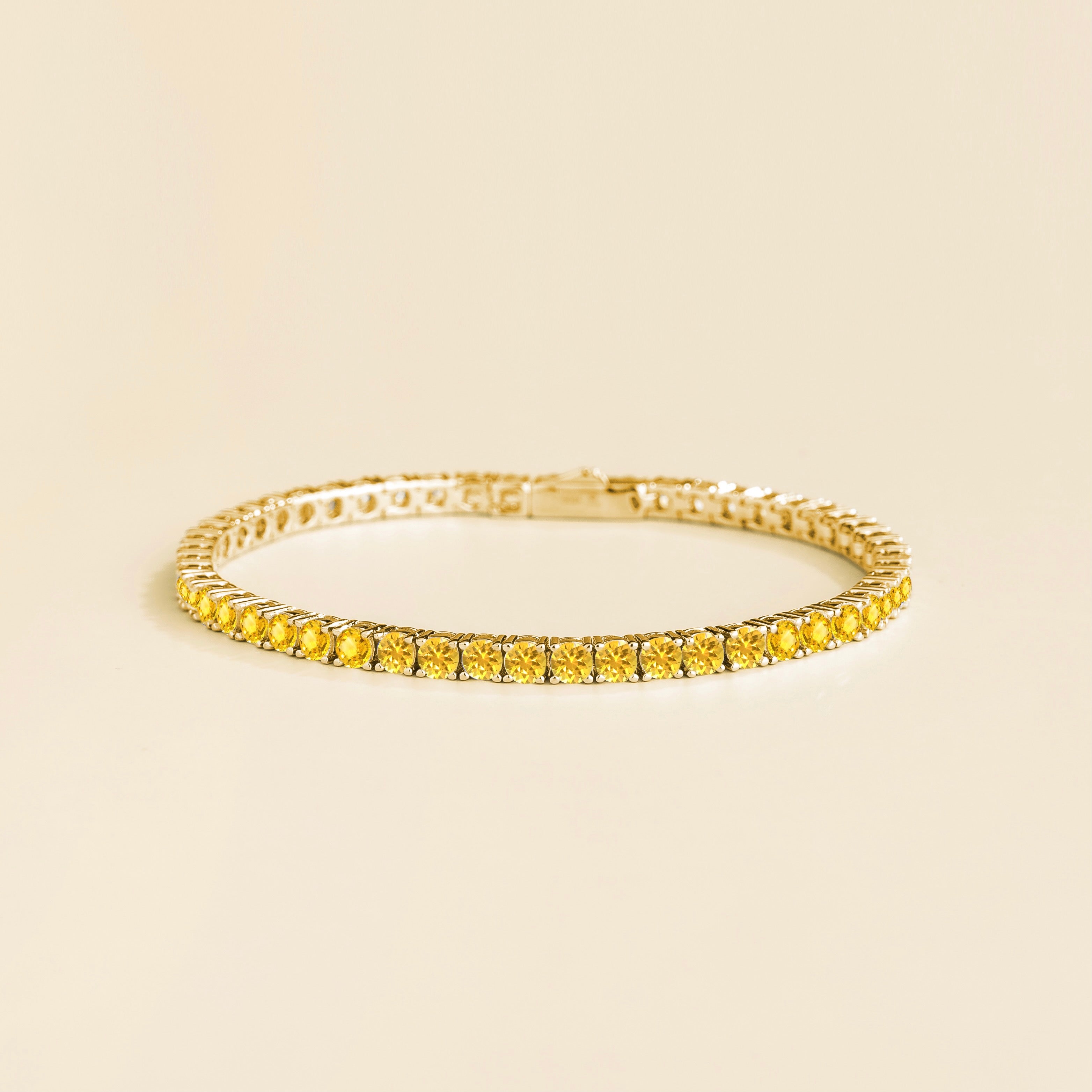 Elegant Gold Tennis Bracelet Featuring Round Yellow Sapphire ā Sustainable Luxury