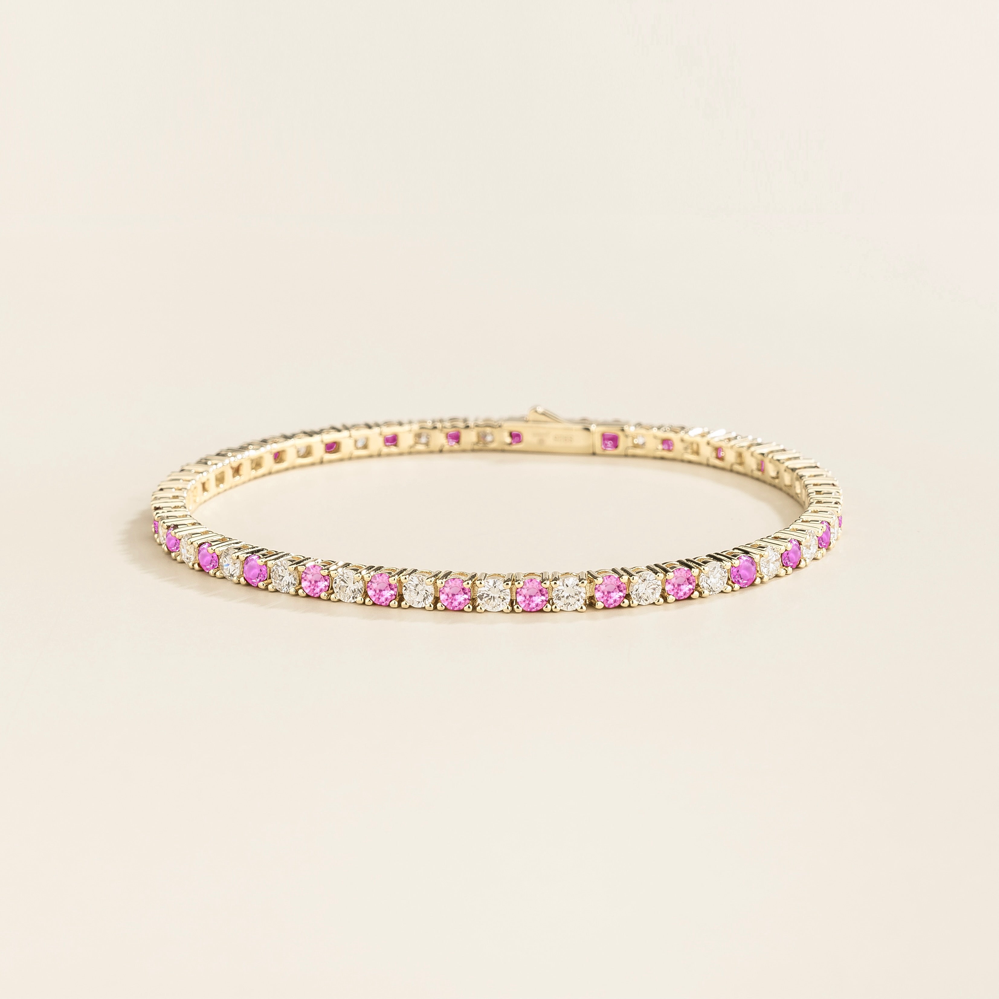 ciclo white gold tennis bracelet with round pink sapphire and lab grown diamonds