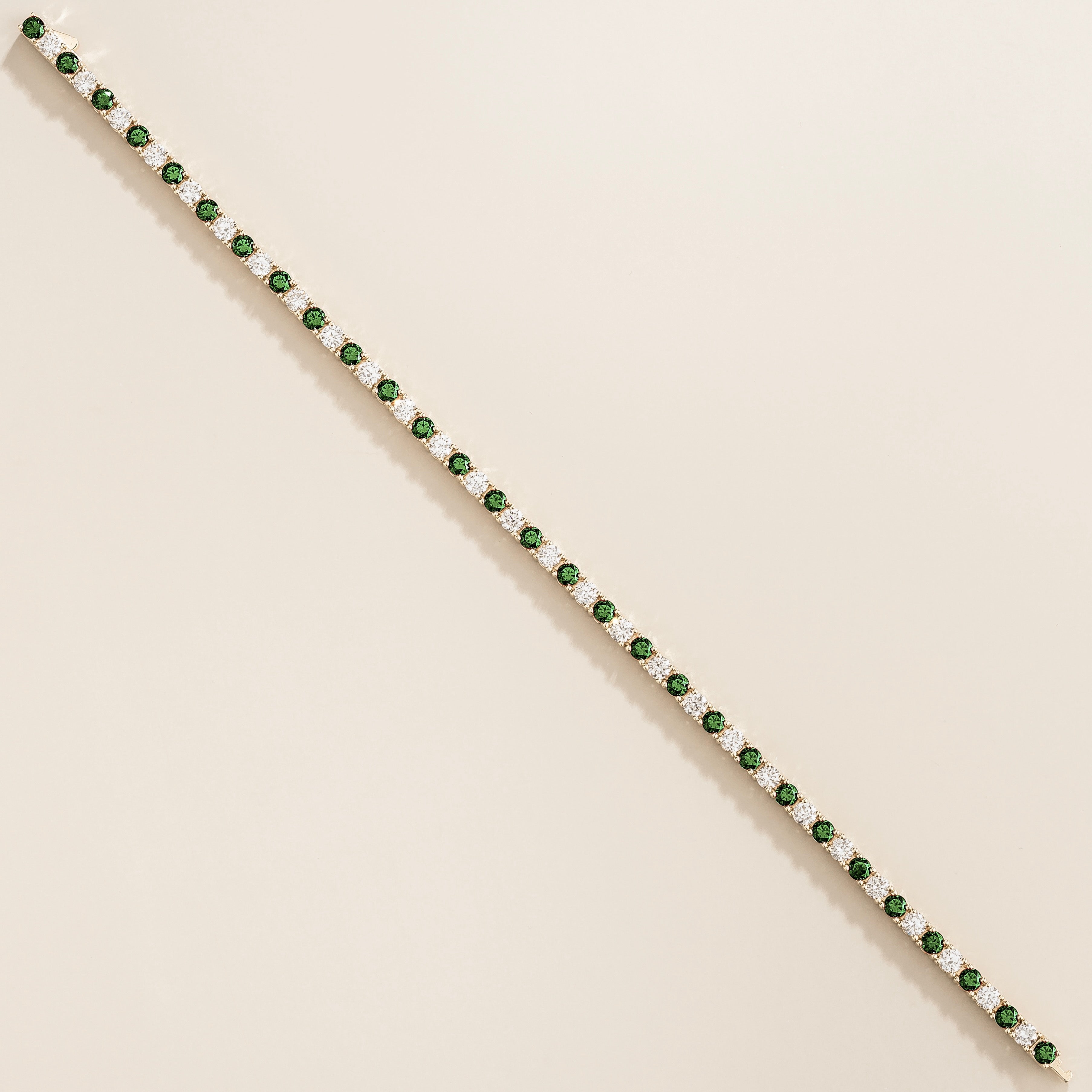 Ciclo White Gold Tennis Bracelet Set With Emerald And Diamond by Juvetti Jewellery from London
