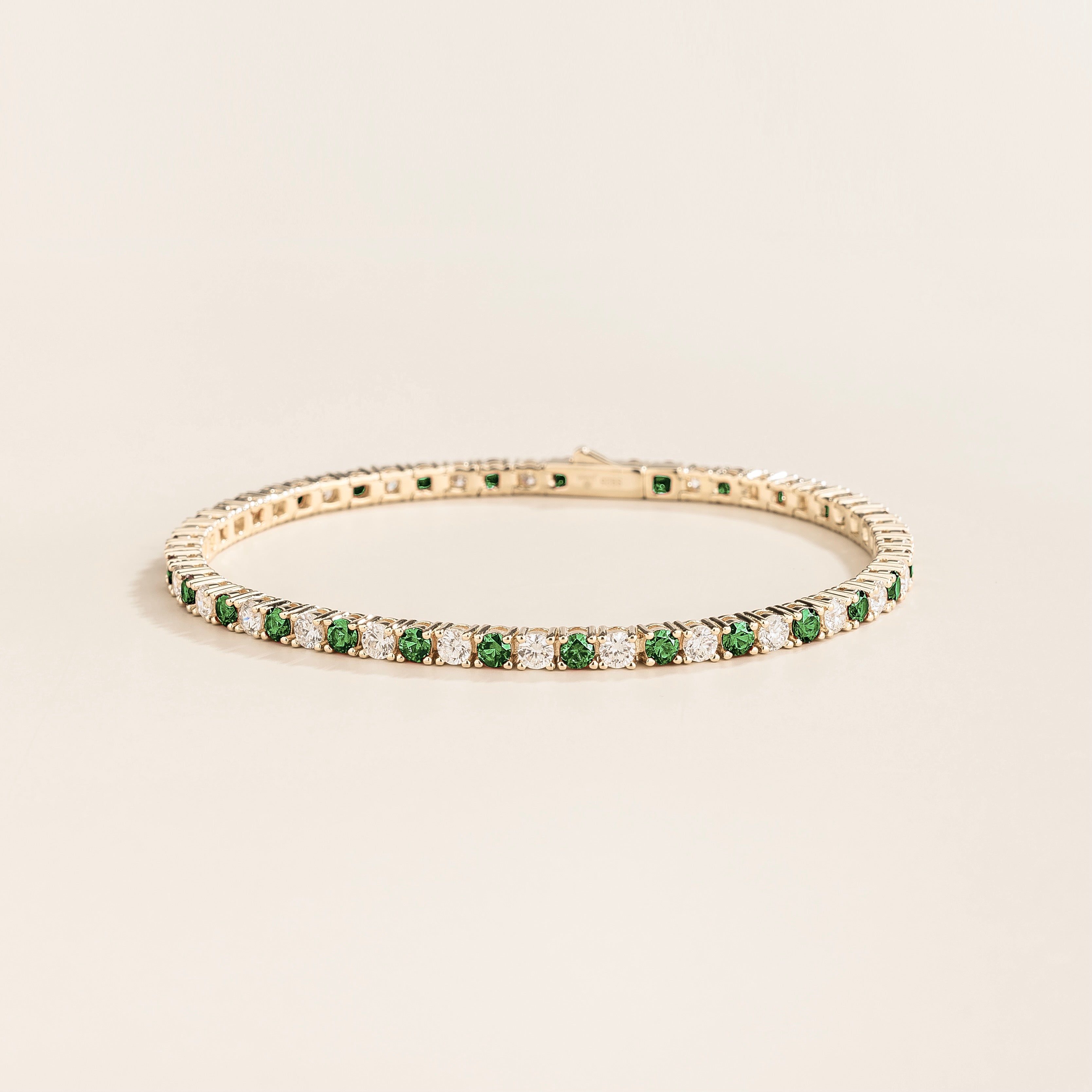 Ciclo White Gold Tennis Bracelet Set With Round Emerald And Diamond from UK