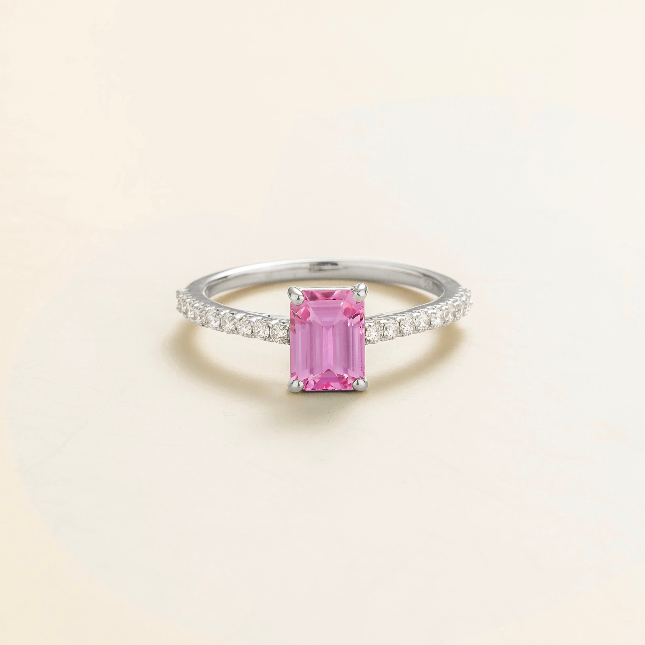 Juvetti white gold fine jewellery ring with lab-grown pink sapphire emerald cut and round lab-grown diamond band.