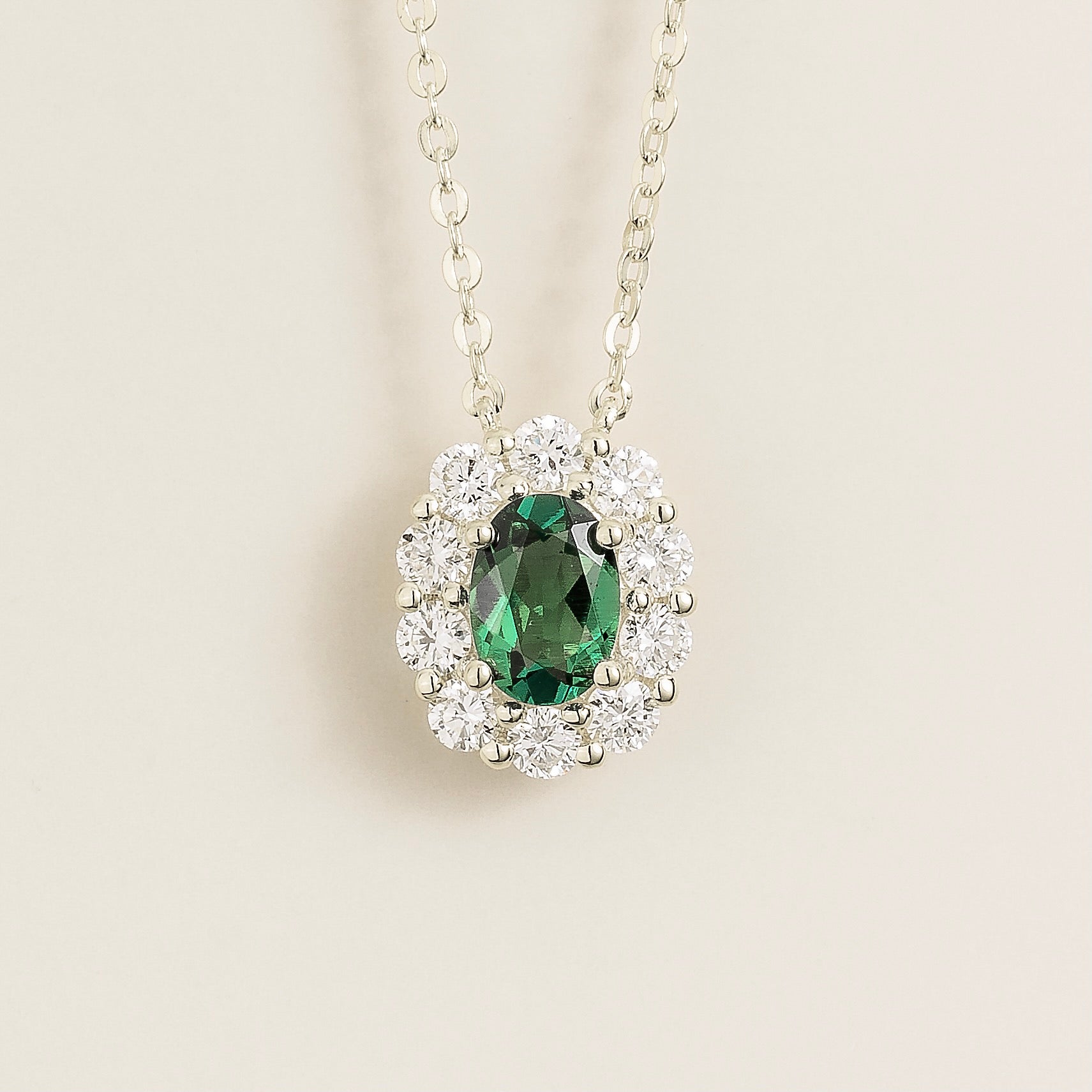 Prill Emerald Oval & Diamond Halo Necklace In White Gold
