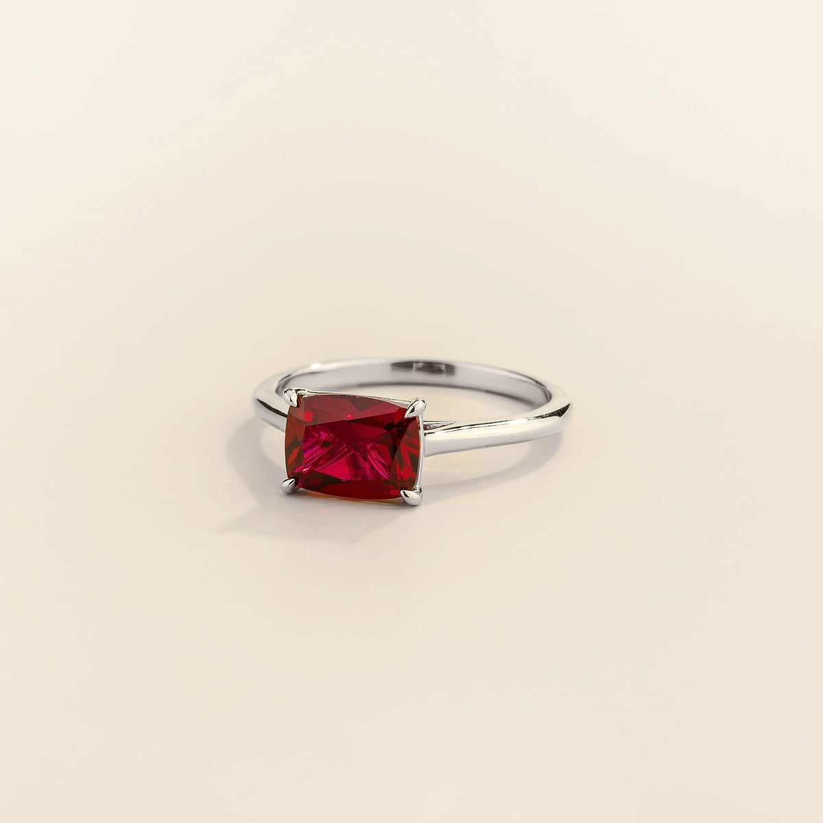 East-West Cushion Cut Ruby Solitaire Ring in White Gold