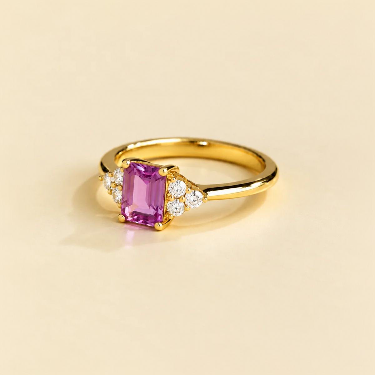Angled view of the emerald cut purple sapphire on the Chateau ring in gold, Juvetti jewellery
