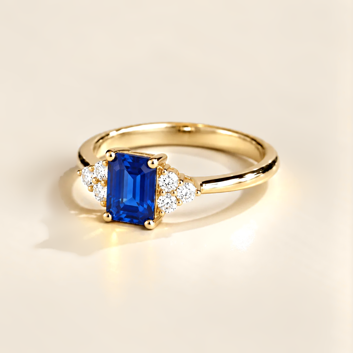Emerald-cut lab-grown blue sapphire and diamond Chateau ring in gold | Juvetti London