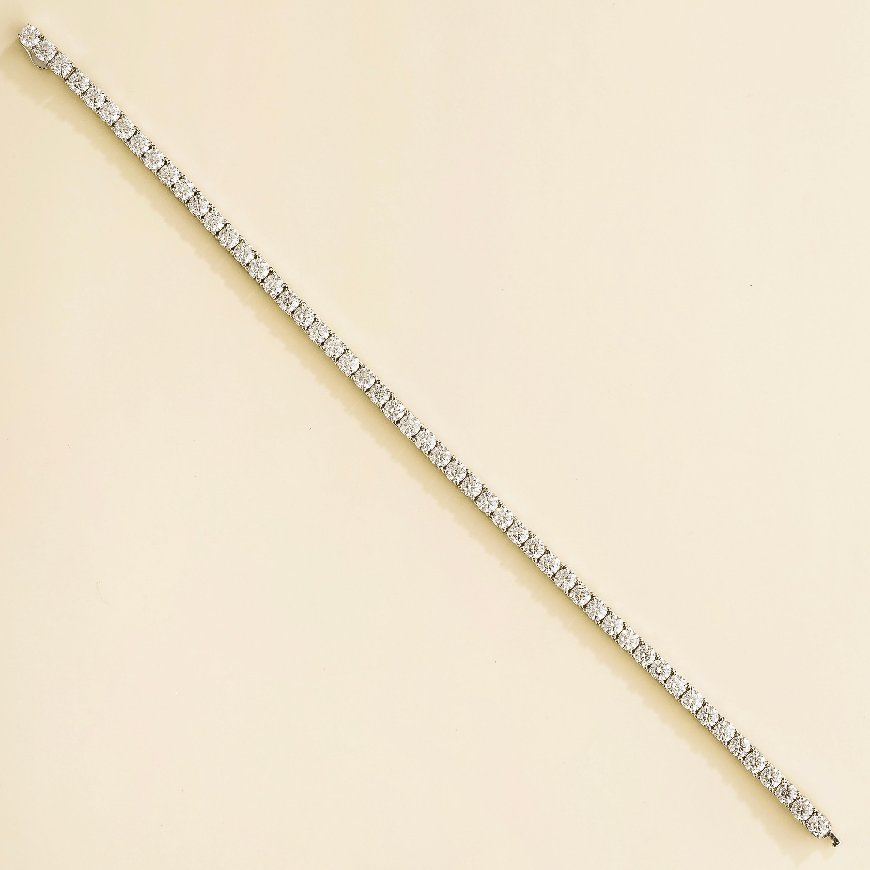 elegant white gold tennis bracelet featuring round diamonds
