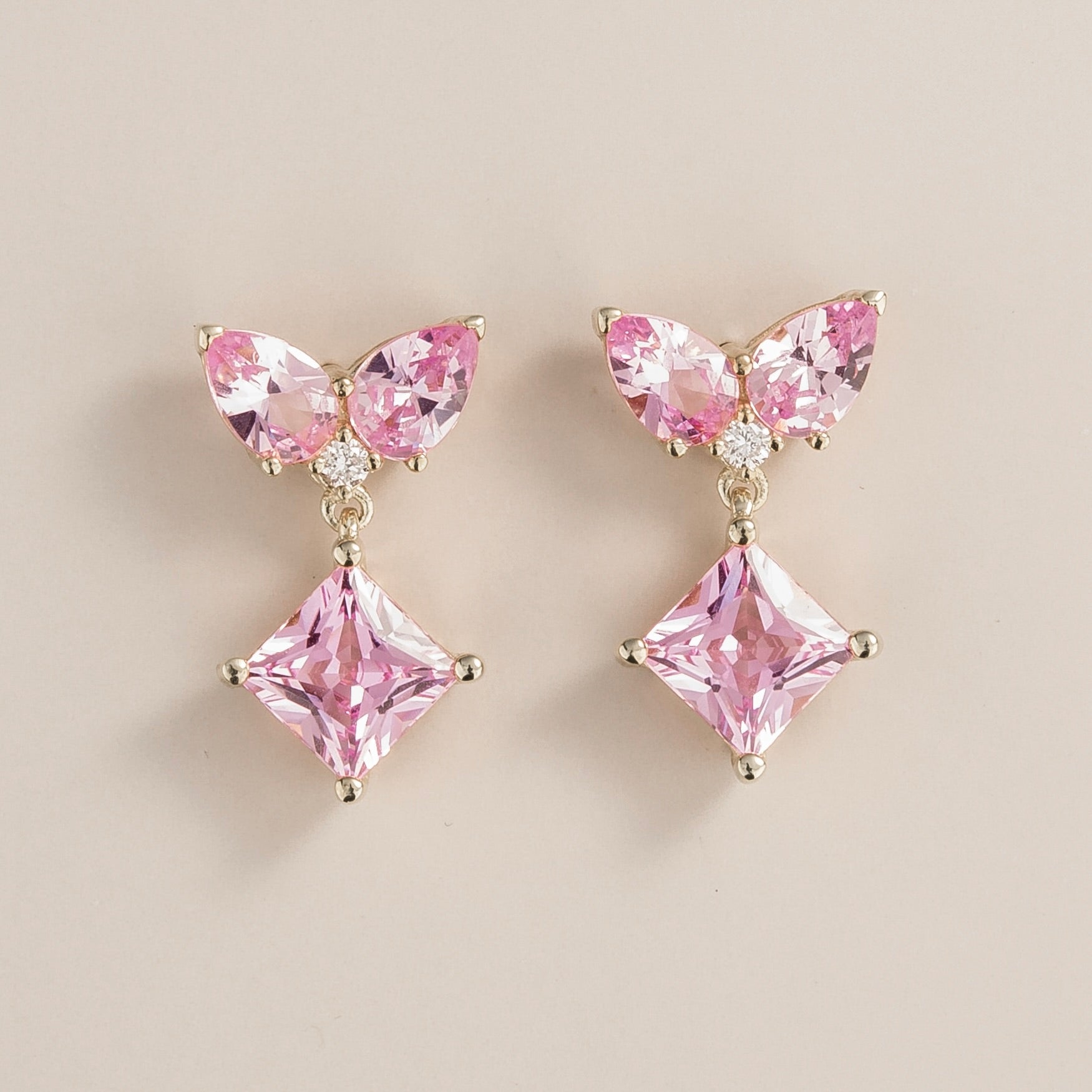 Butterfly-shaped lab-grown pink sapphire and diamond drop earrings, Amore design in white gold | Juvetti London