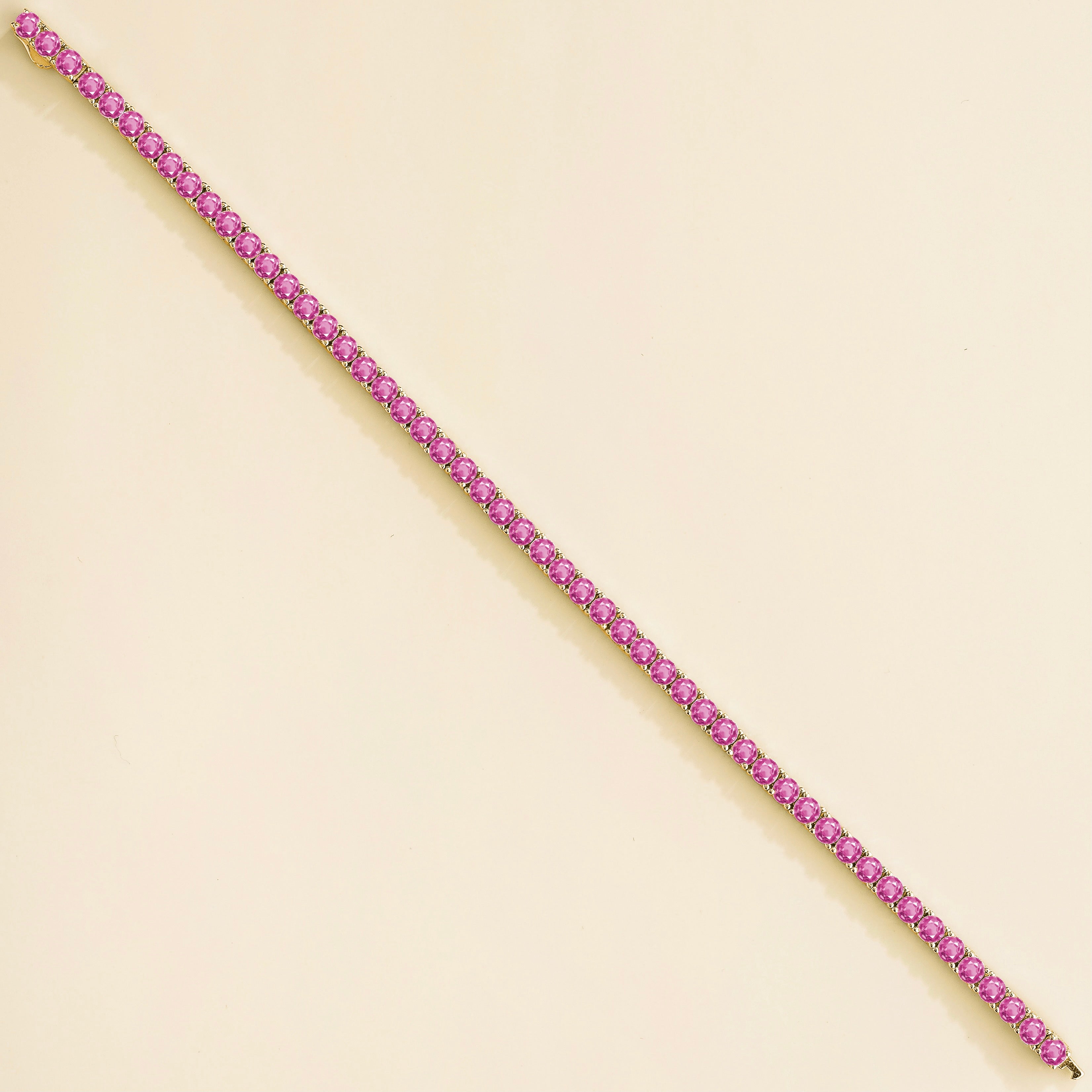 Ciclo Pink Sapphire Round Tennis Bracelet in Gold