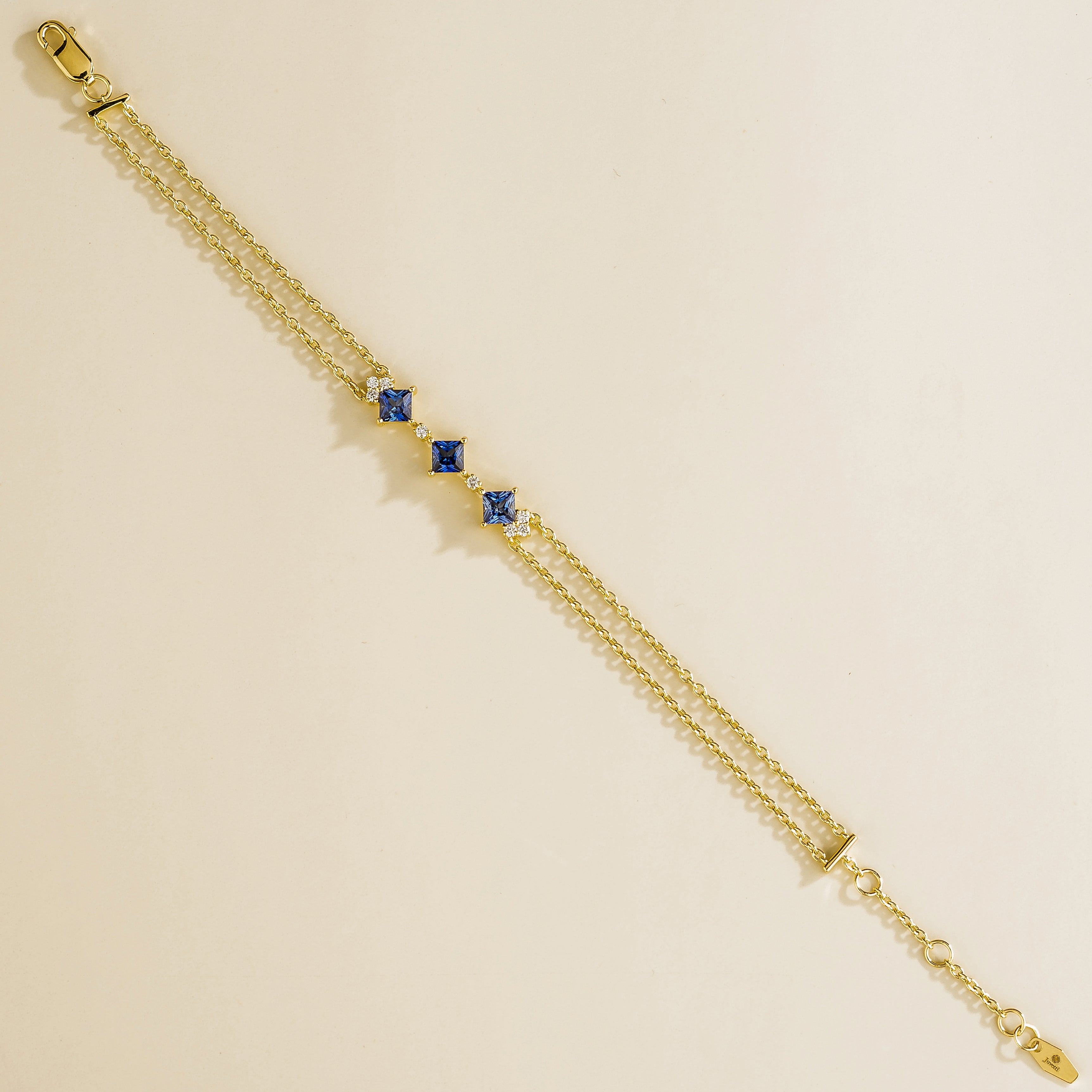 elegant gold bracelet set with blue sapphires and diamonds