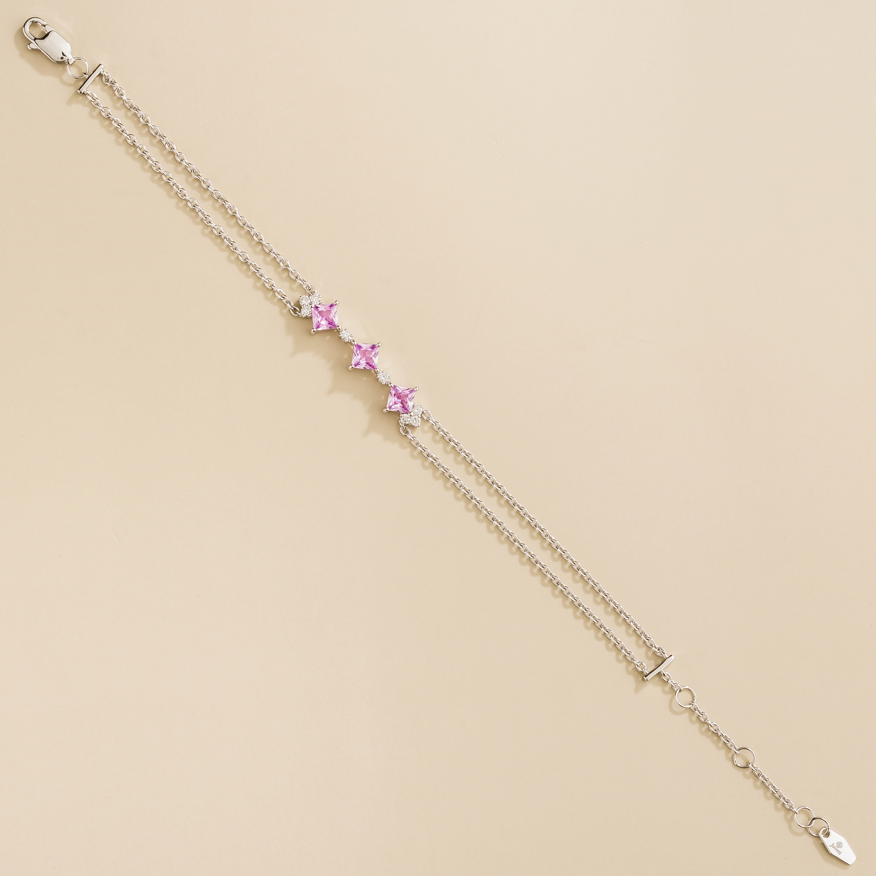 elegant forma bracelet in white gold featuring pink sapphires and diamonds