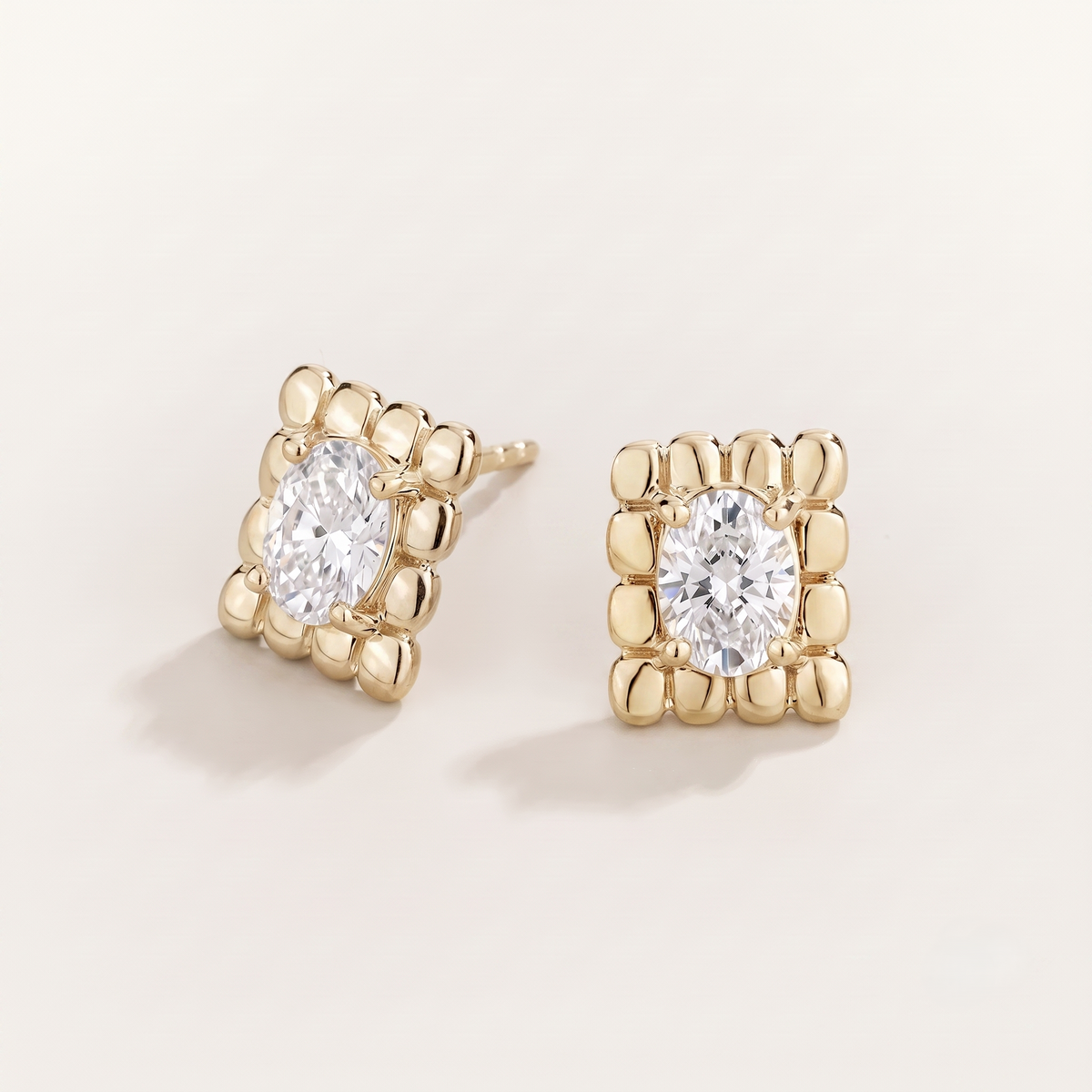 Fondi Oval Diamond Sculpted Gold Stud Earrings – front view