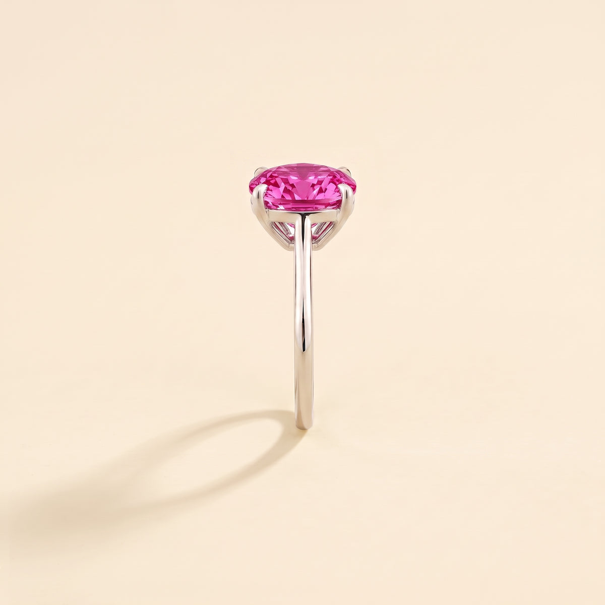 Iris Cushion Shape Vivid Pink Sapphire Cathedral Solitaire Ring side edge