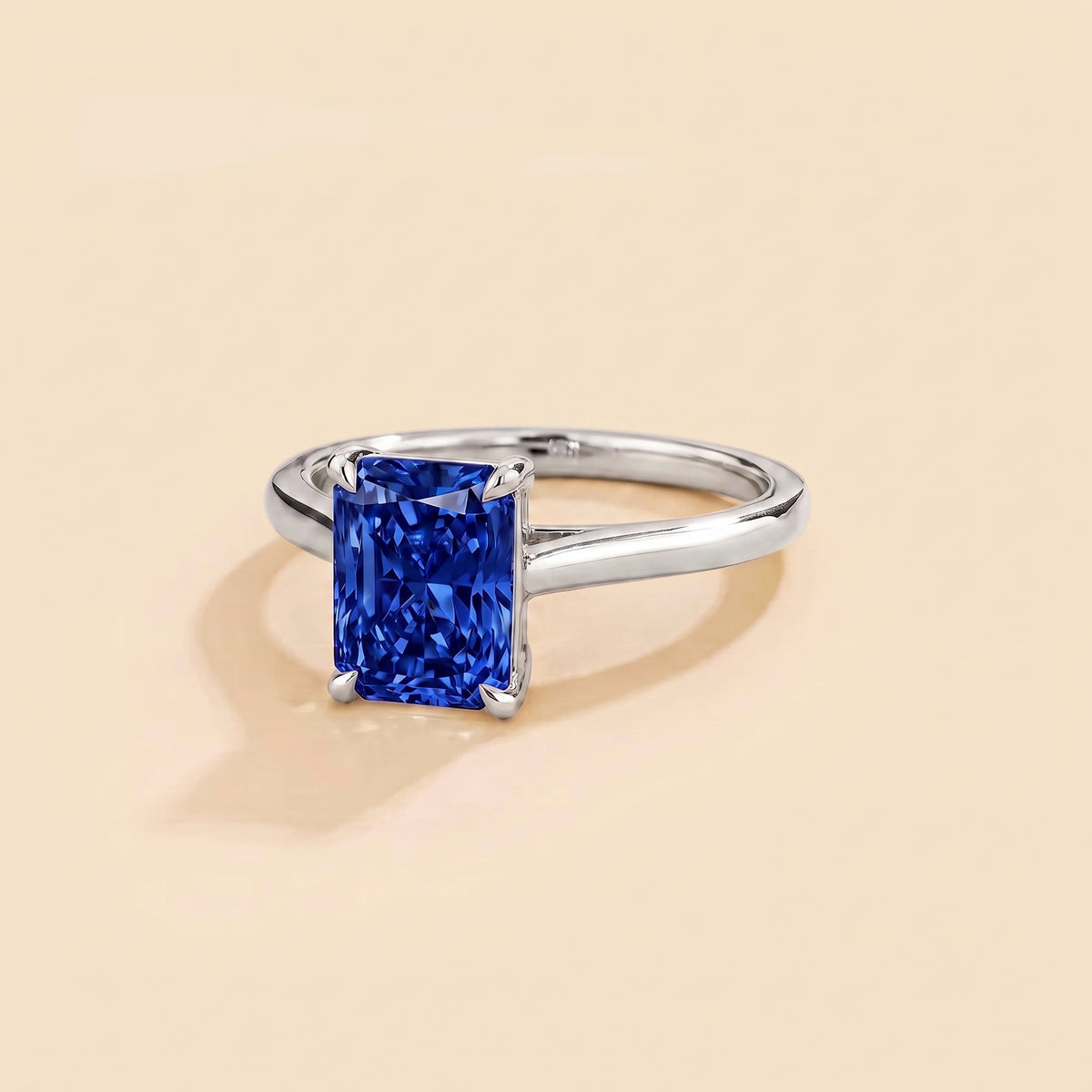 Clair Radiant Shape Blue Sapphire Cathedral Solitaire Ring three quarters